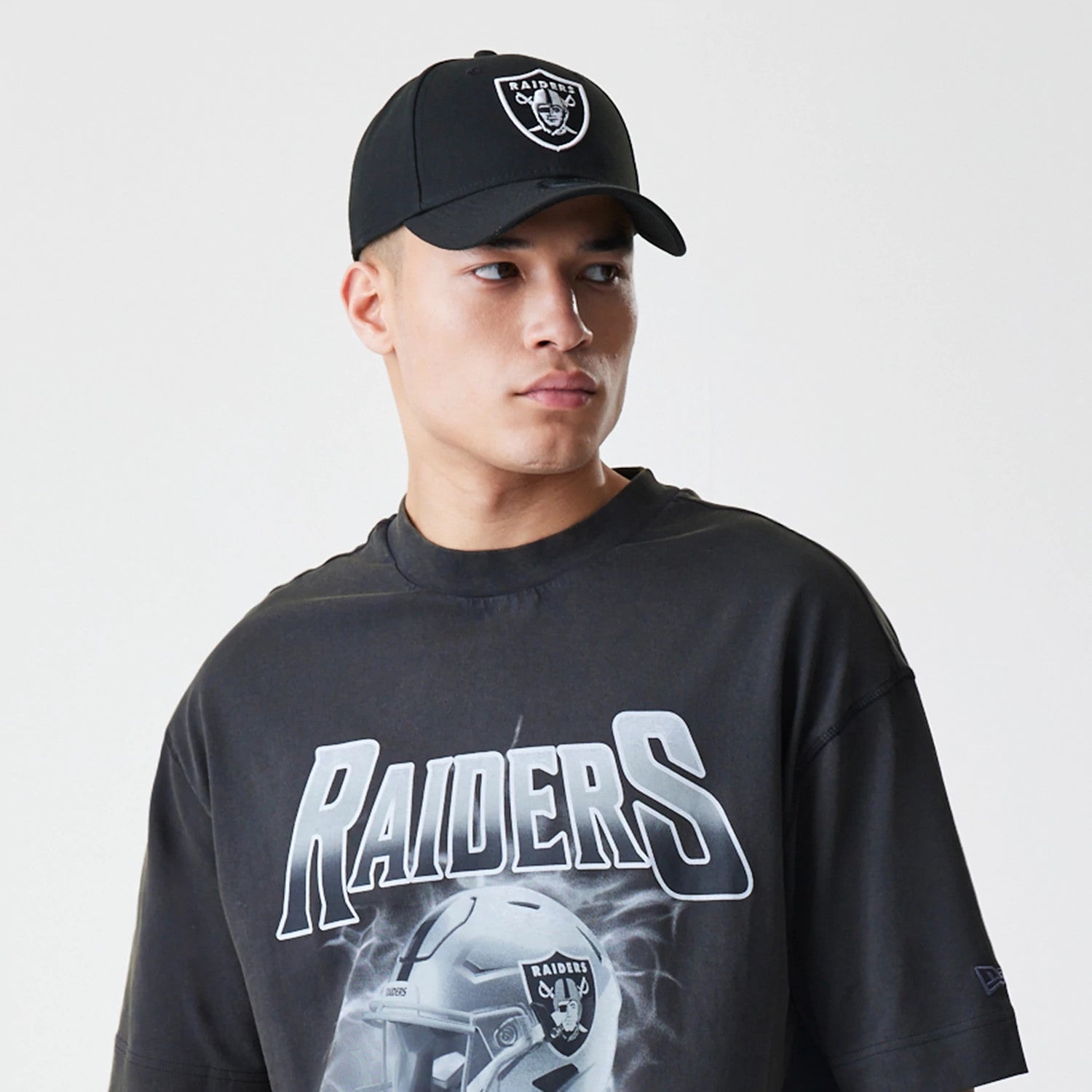 The Male model is wearing Las Vegas Raiders NFL Washed Boxy Dark Grey Oversized T-Shirt 6