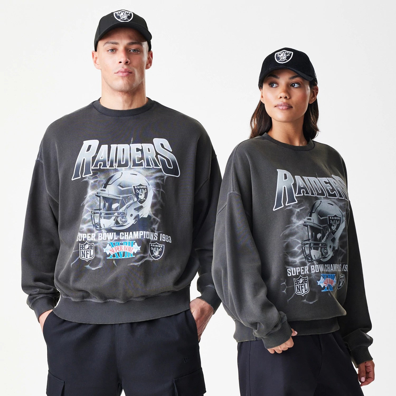 The Male model is wearing Las Vegas Raiders NFL Washed Boxy Dark Grey Oversized Crew Neck Sweater 1