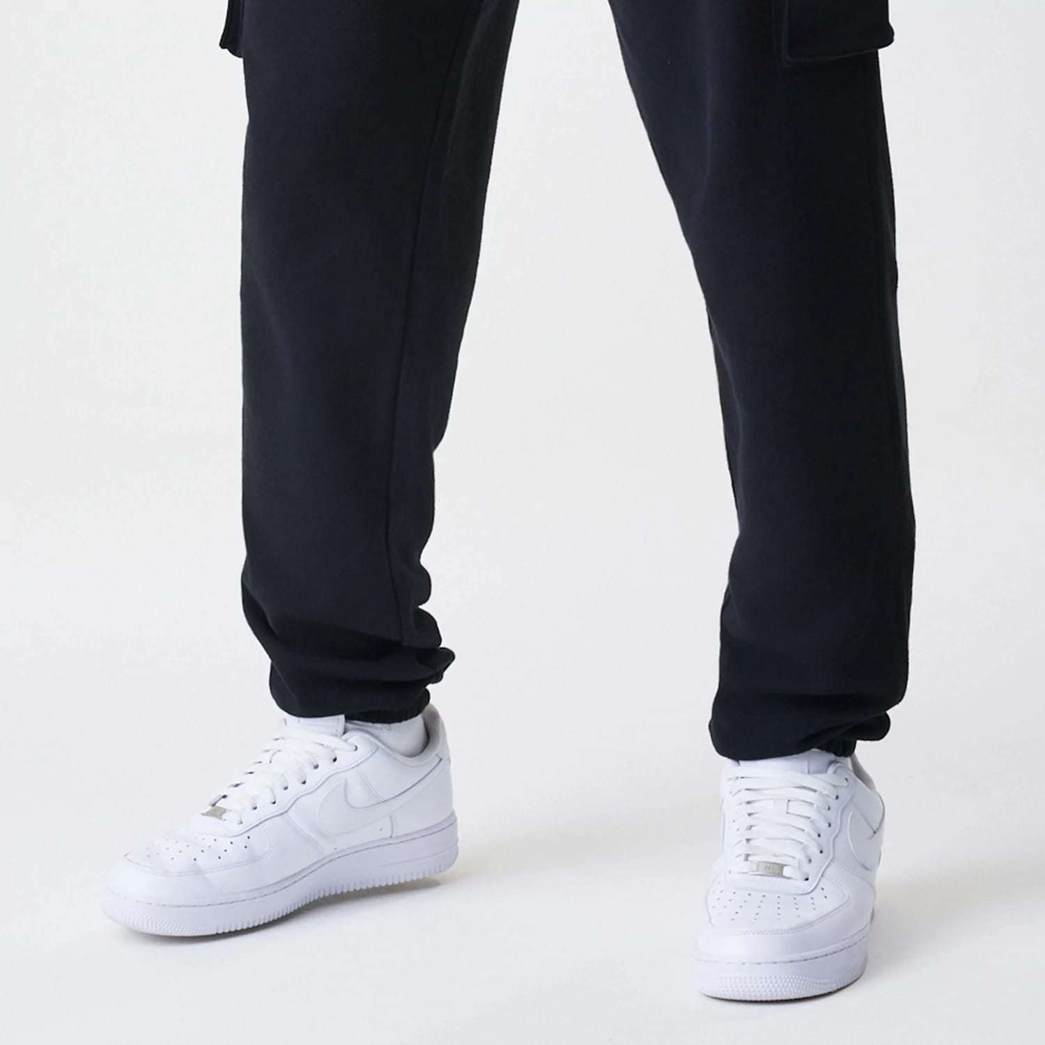 The Male model is wearing  New Era Cargo Black Joggers 5