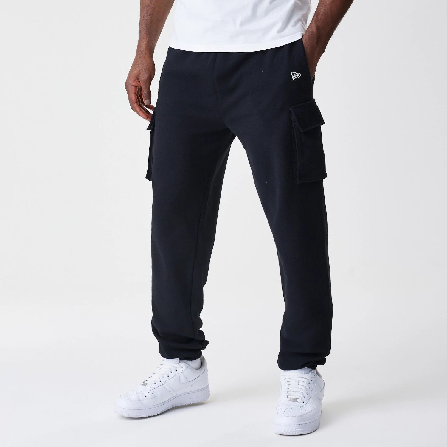 The Male model is wearing  New Era Cargo Black Joggers 1