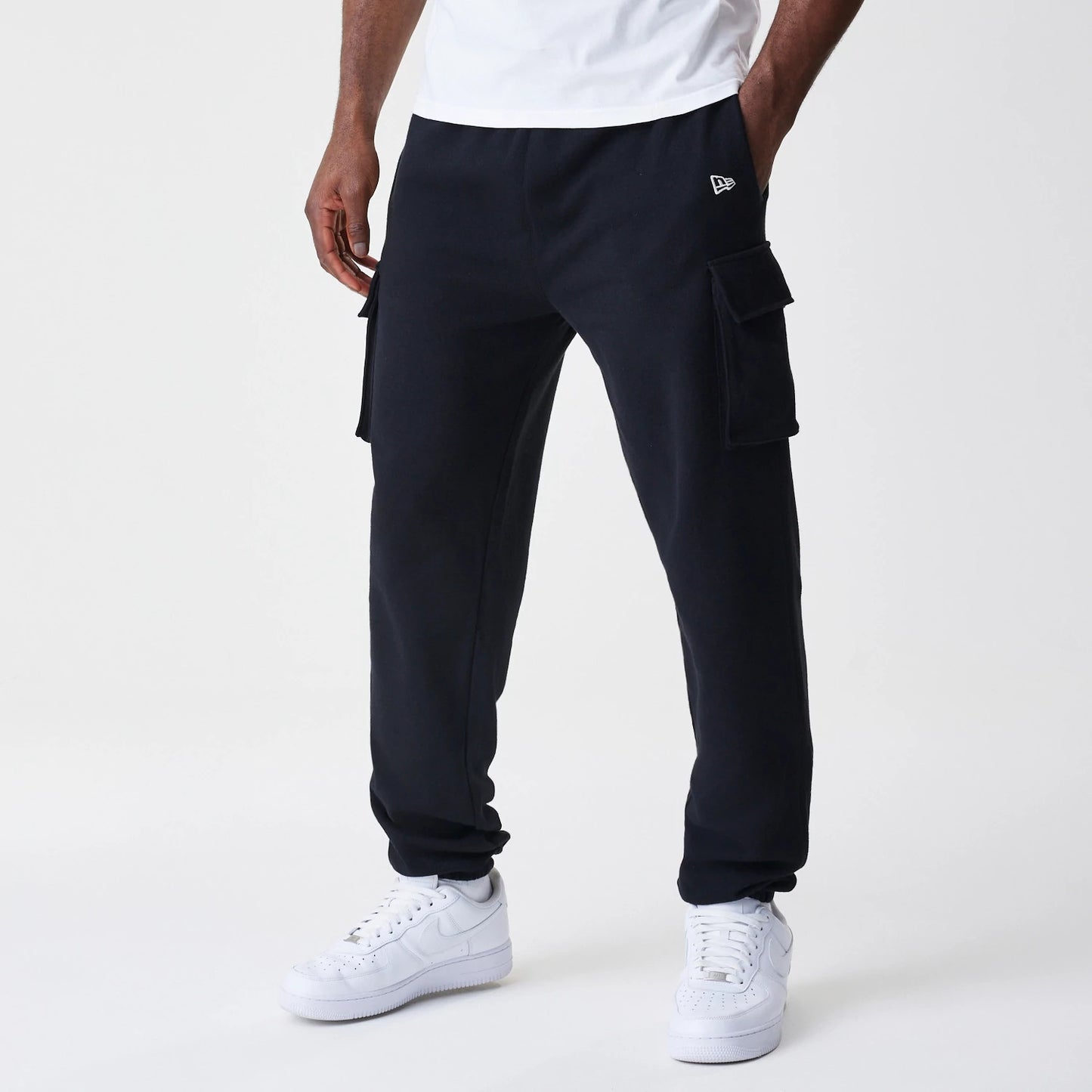 The Male model is wearing  New Era Cargo Black Joggers 1