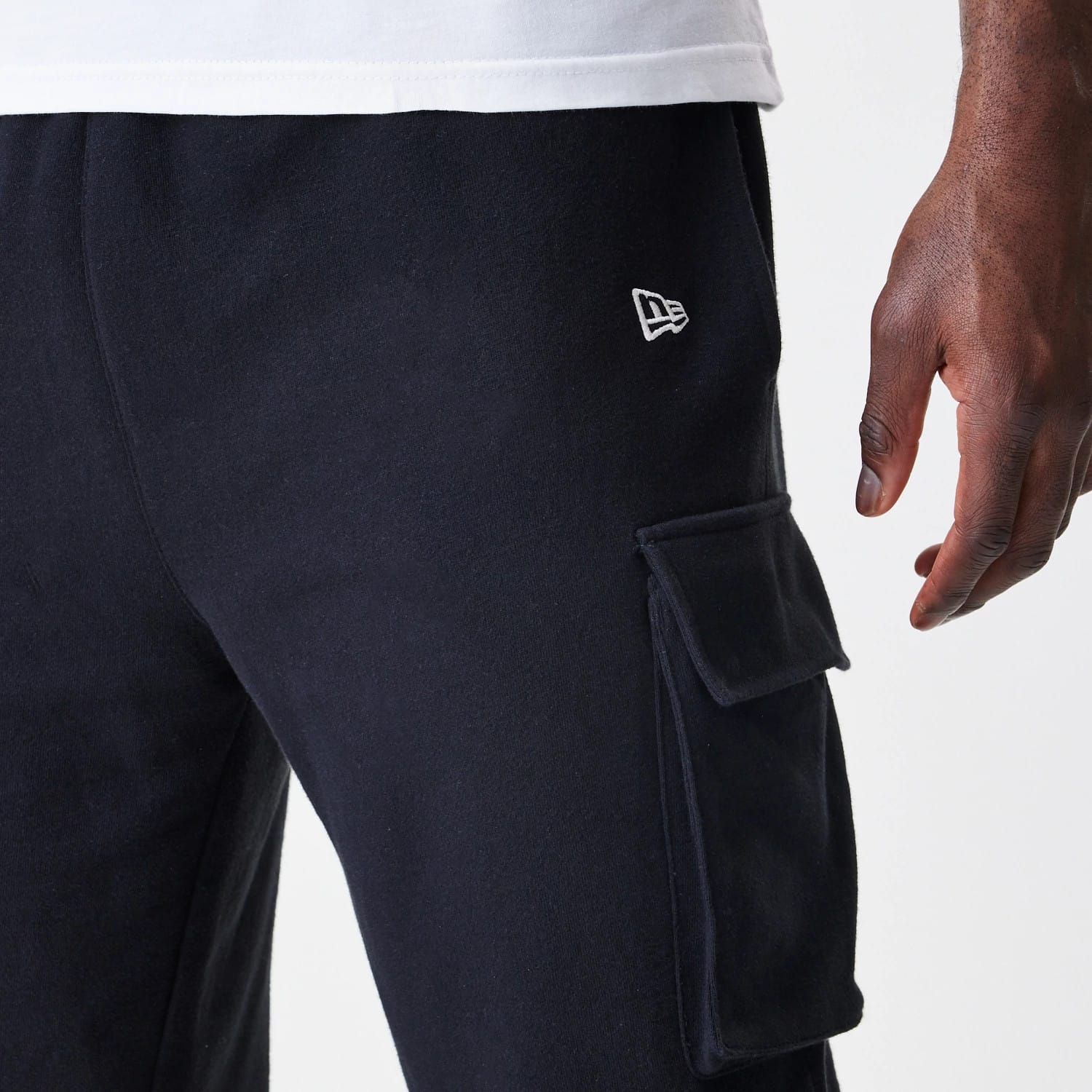 The Male model is wearing  New Era Cargo Black Joggers 4