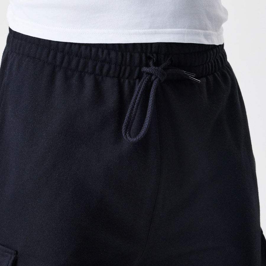 The Male model is wearing  New Era Cargo Black Joggers  6