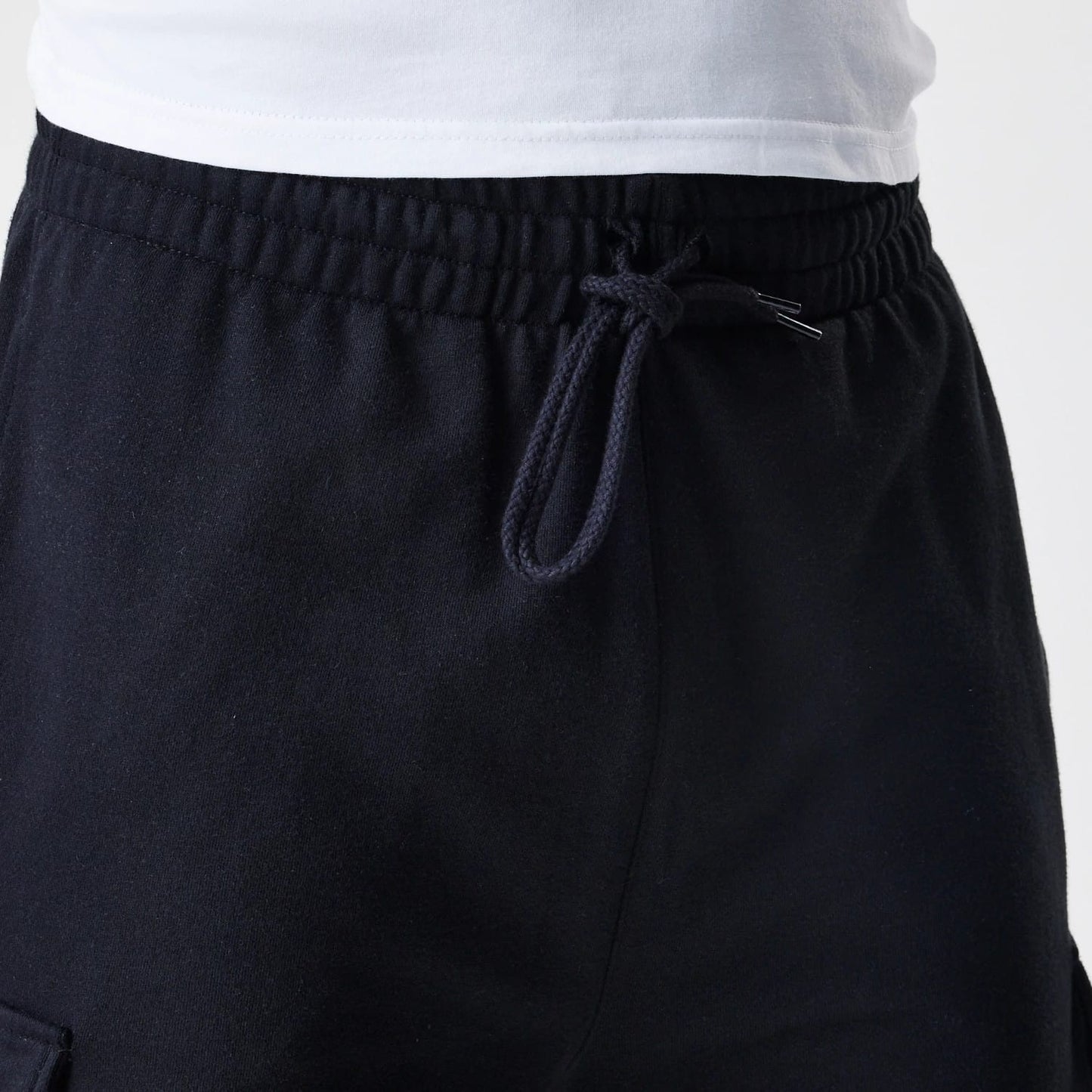 The Male model is wearing  New Era Cargo Black Joggers 6