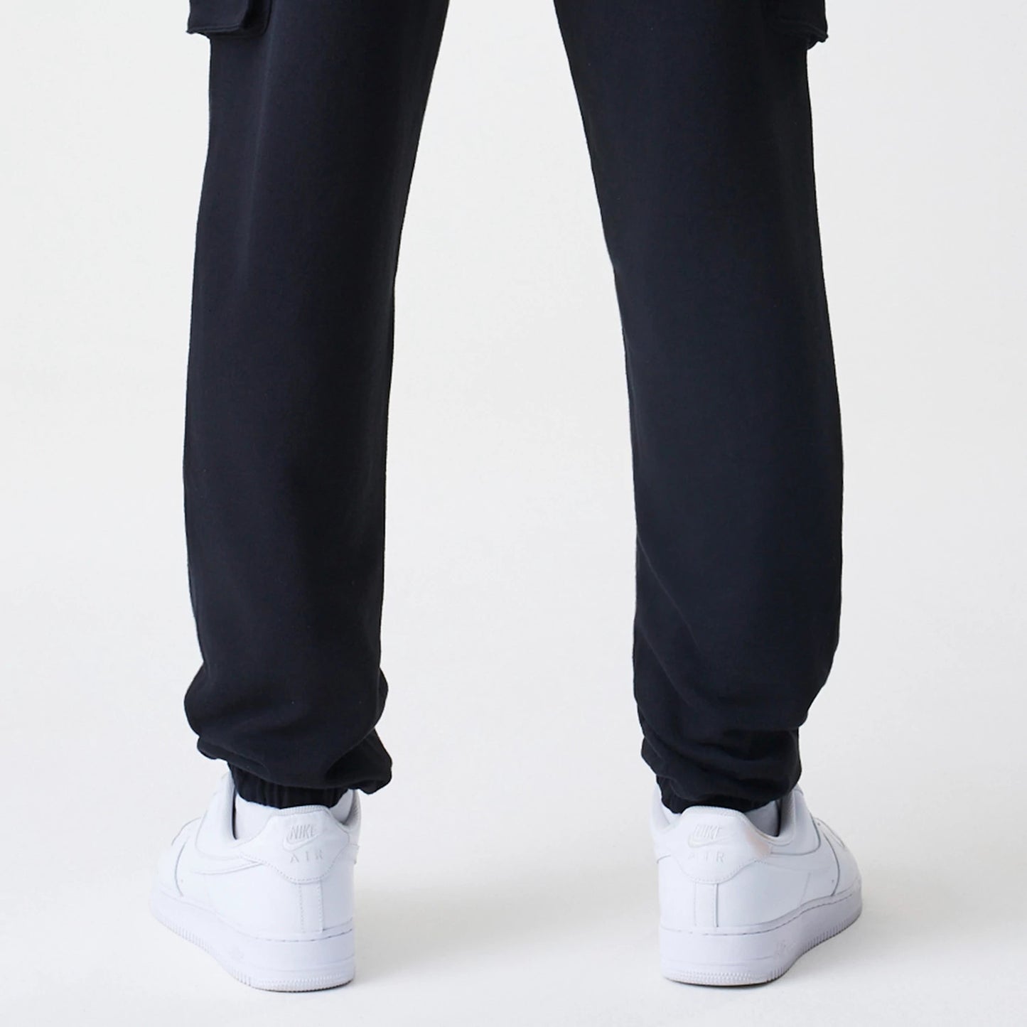 The Male model is wearing  New Era Cargo Black Joggers 7