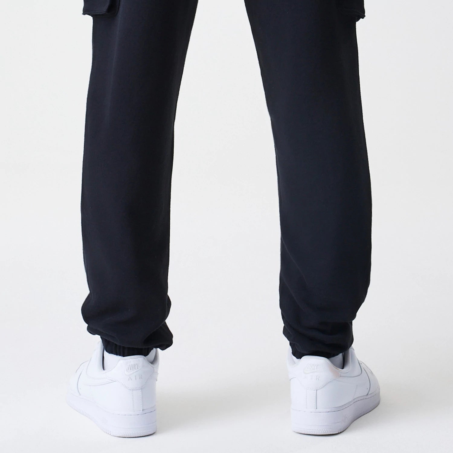 The Male model is wearing  New Era Cargo Black Joggers 7