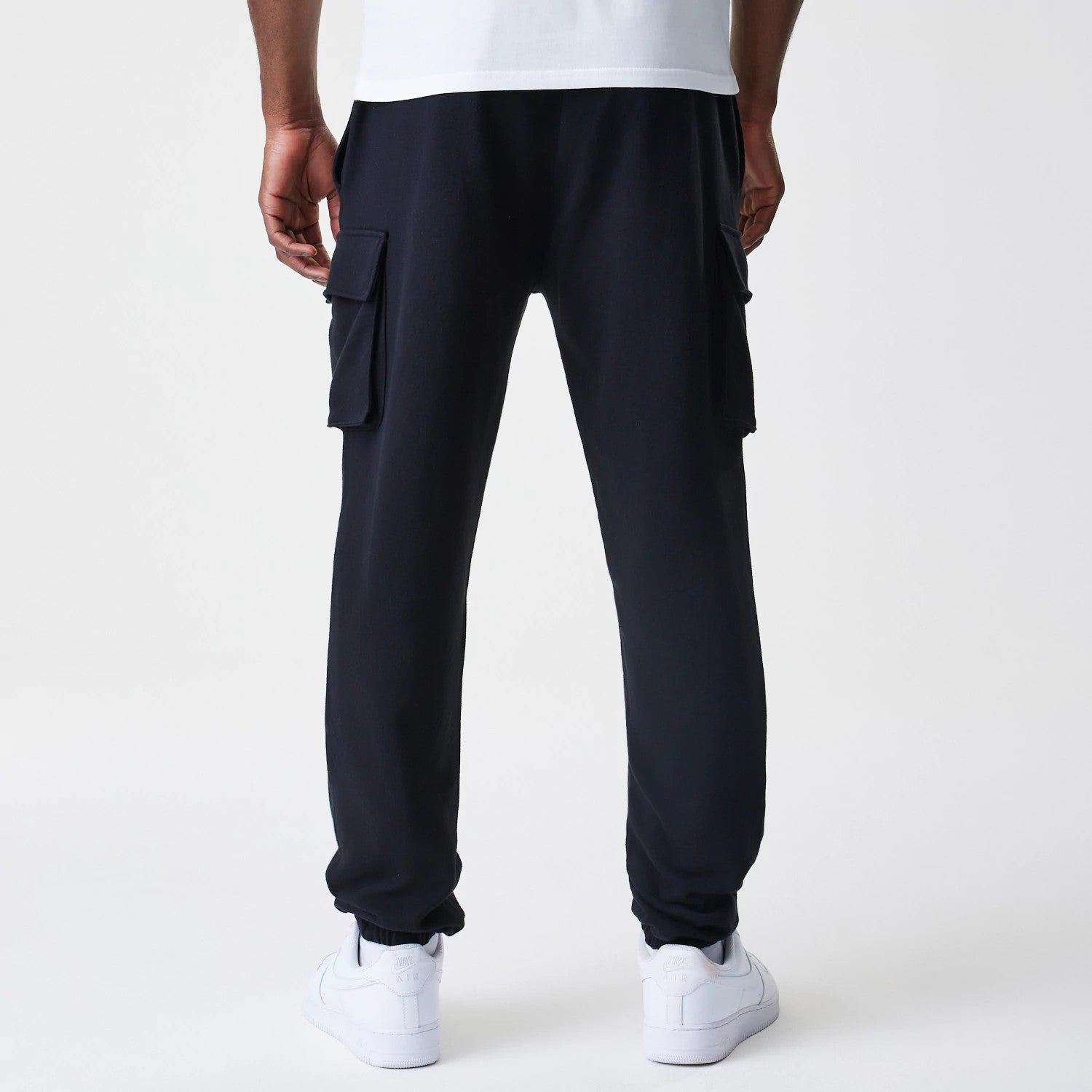 The Male model is wearing  New Era Cargo Black Joggers 2