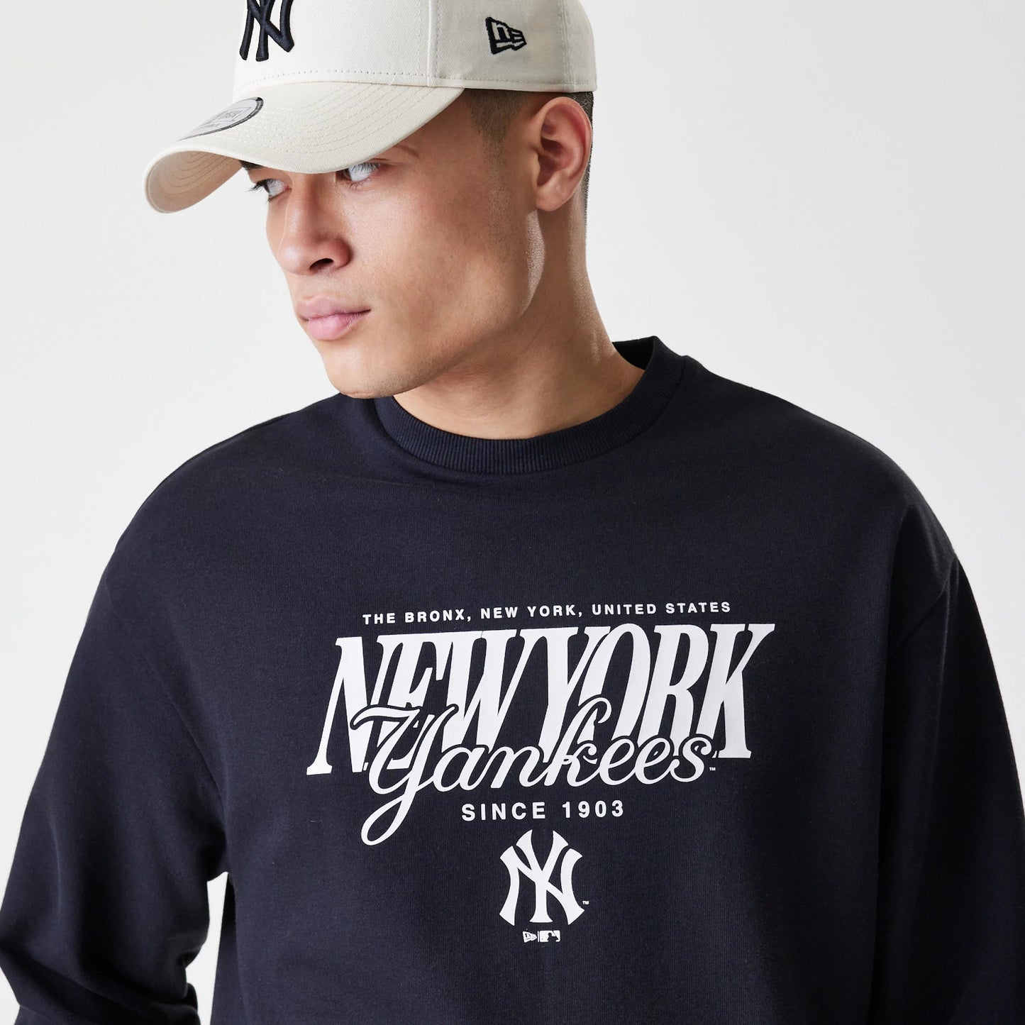 The Male model is wearing New York Yankees MLB Script Black Crew Neck Sweater 4
