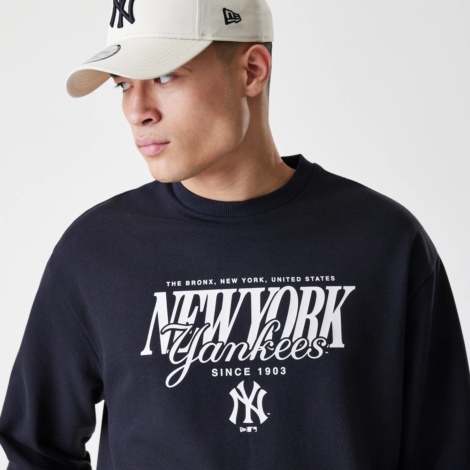The Male model is wearing New York Yankees MLB Script Black Crew Neck Sweater 4