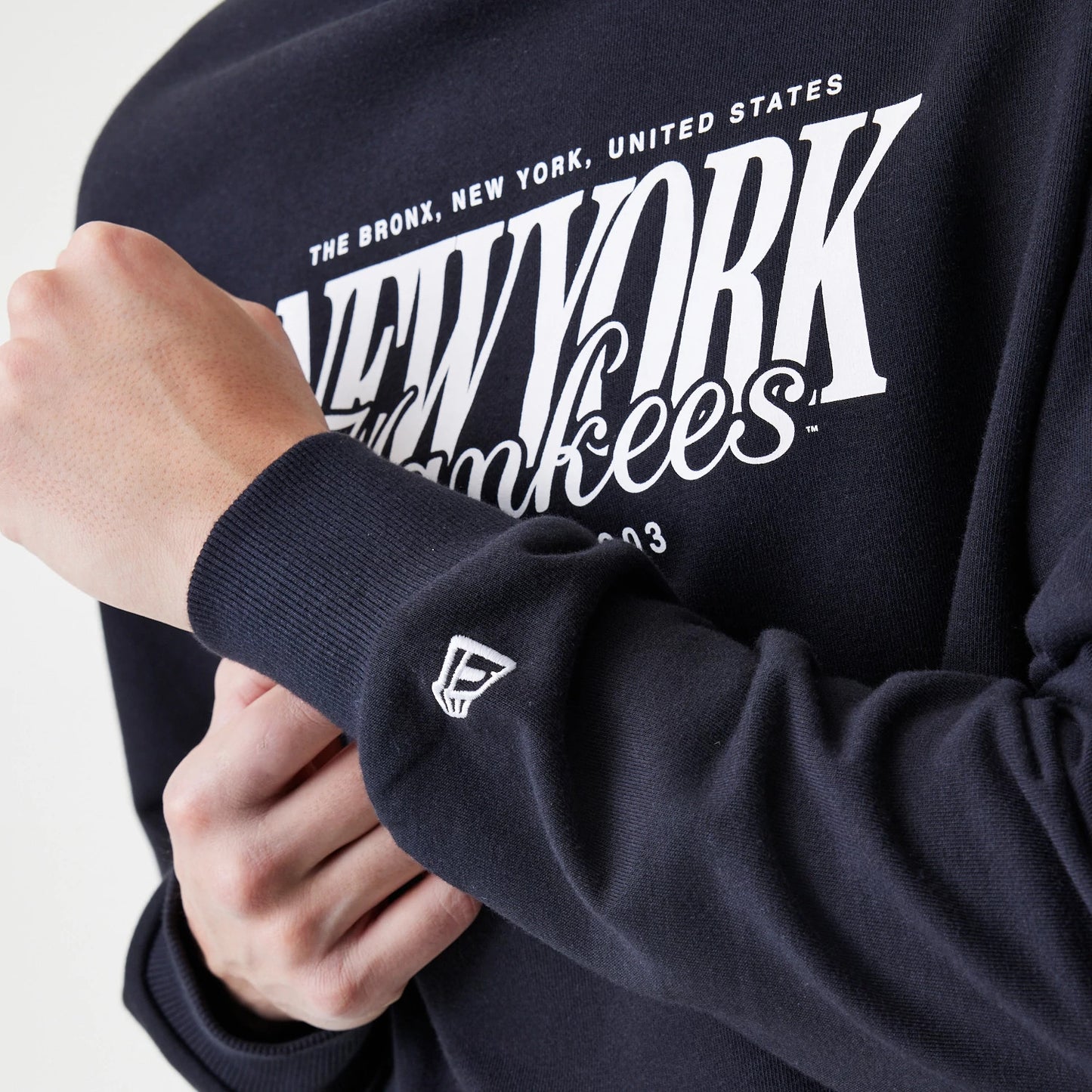 The Male model is wearing New York Yankees MLB Script Black Crew Neck Sweater 5