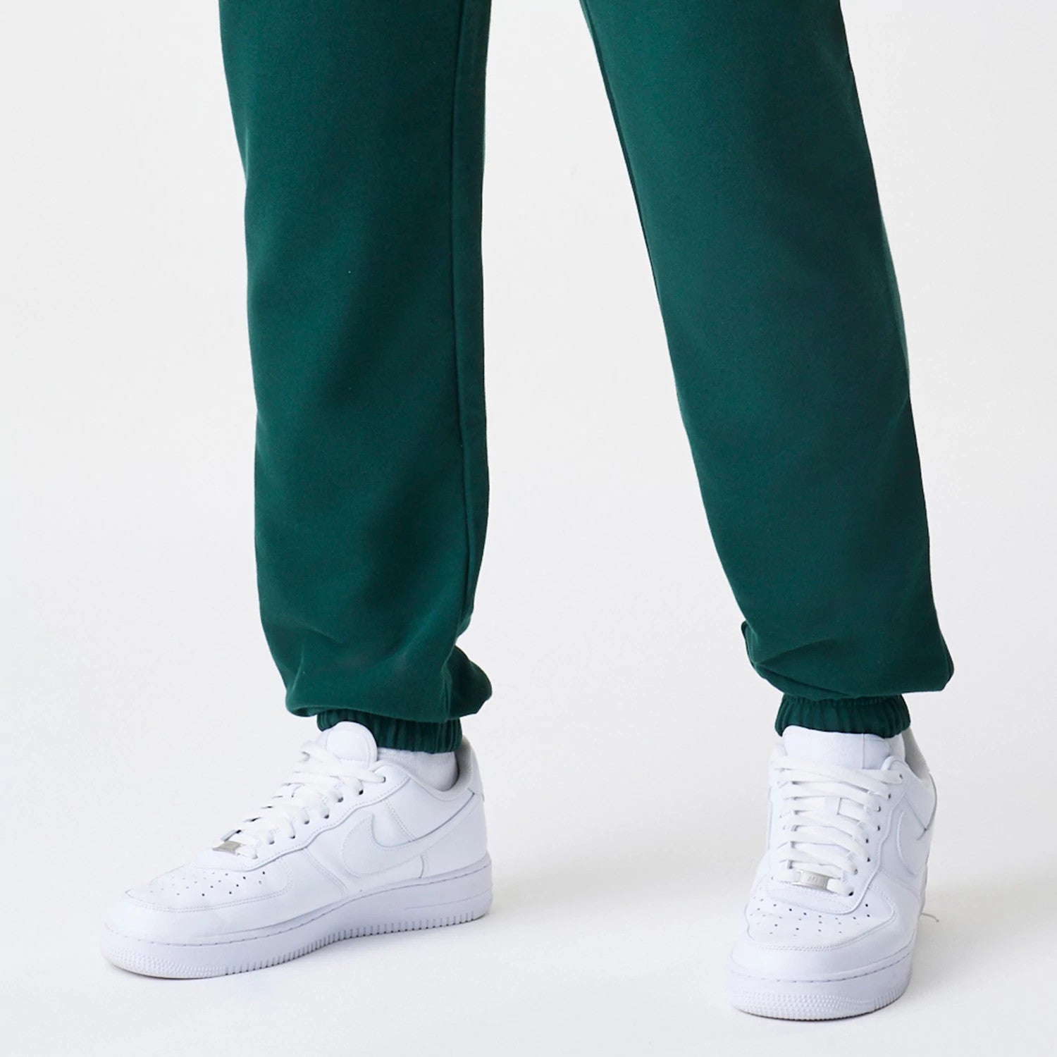 The Male model is wearing  New Era Core Cargo Dark Green Joggers 4