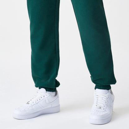 The Male model is wearing  New Era Core Cargo Dark Green Joggers 4