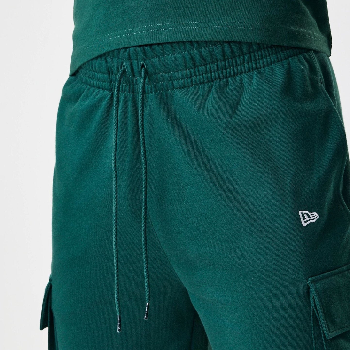 The Male model is wearing  New Era Core Cargo Dark Green Joggers  5