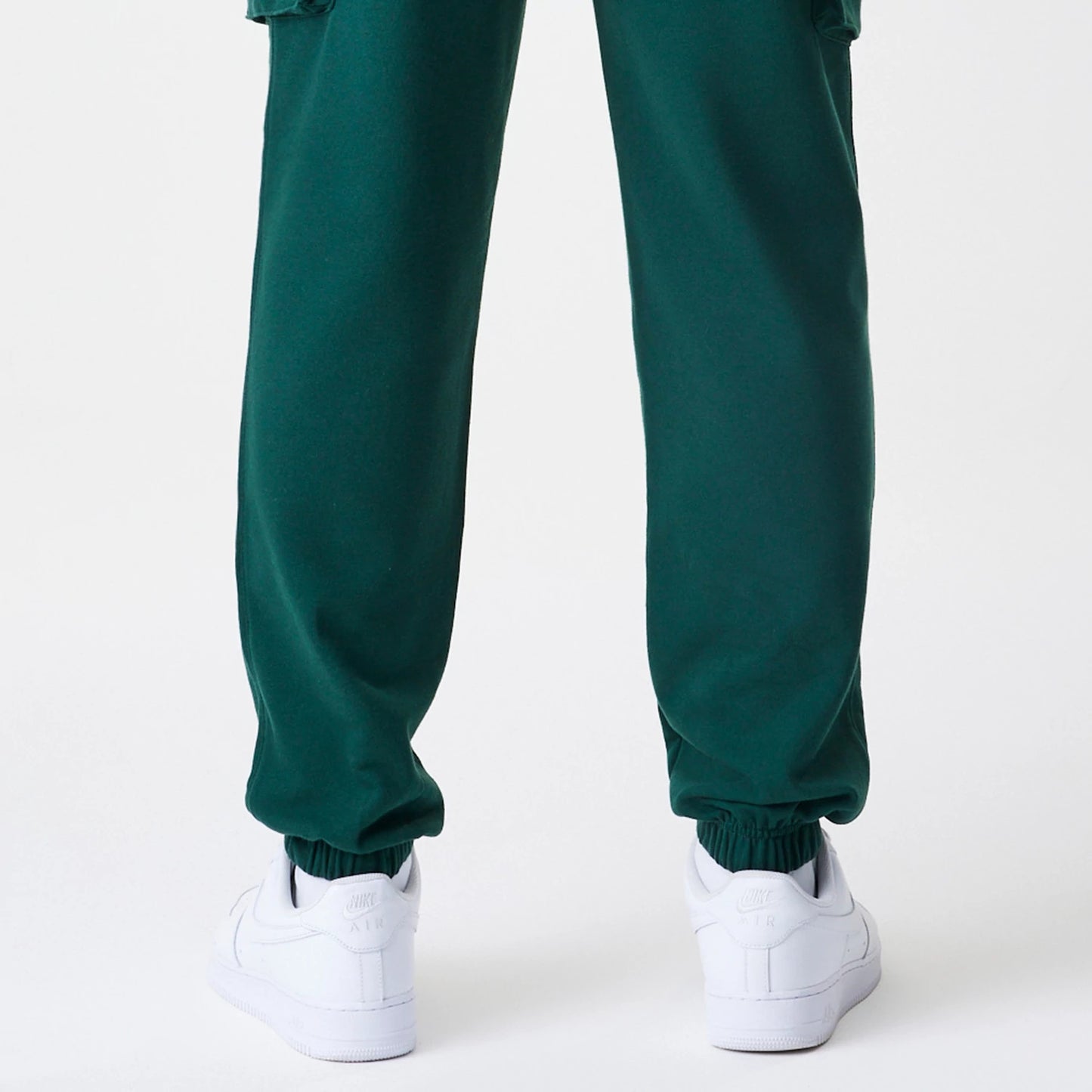 The Male model is wearing  New Era Core Cargo Dark Green Joggers 6