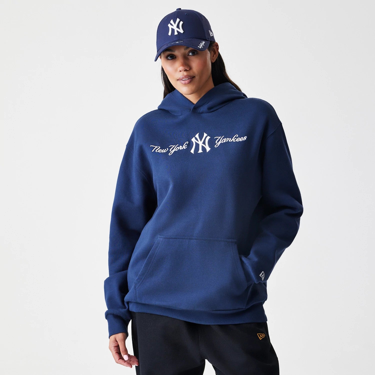The Male model is wearing New York Yankees MLB Script Navy Oversized Pullover Hoodie 4