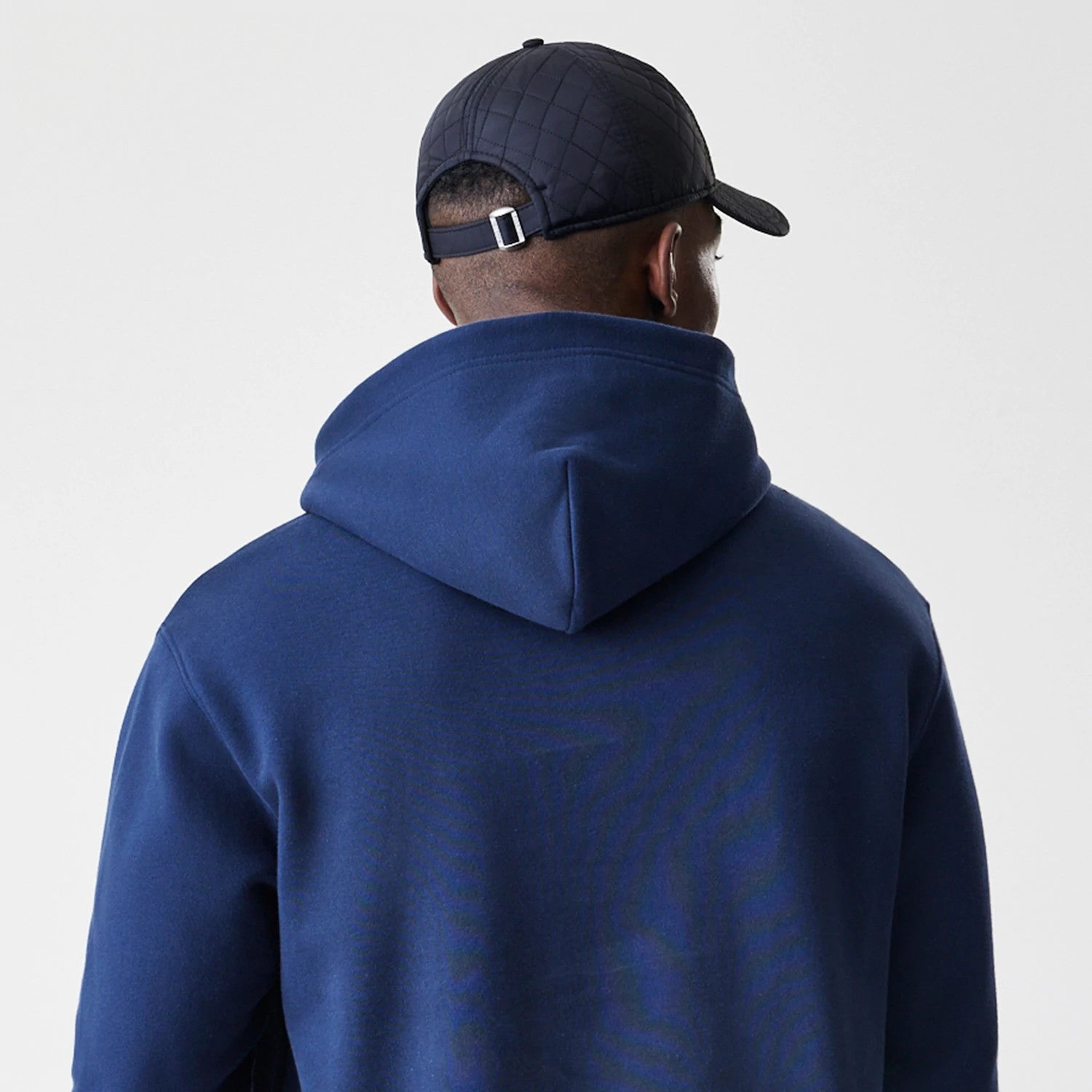 The Male model is wearing New York Yankees MLB Script Navy Oversized Pullover Hoodie 7