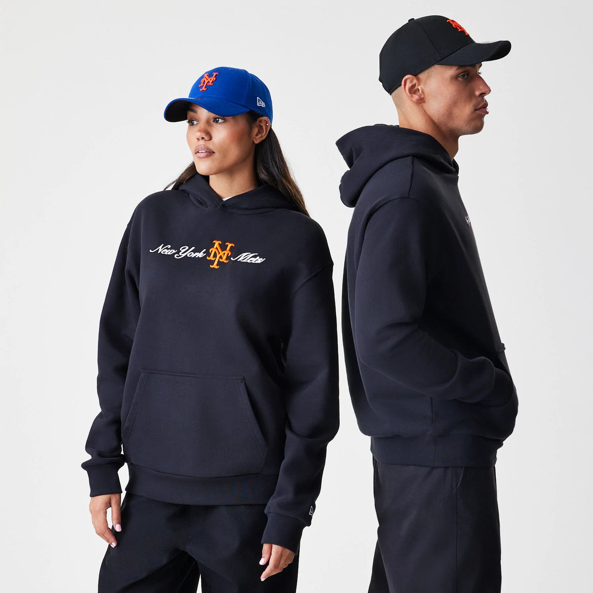 The Male model is wearing New York Mets MLB Script Black Oversized Pullover Hoodie 1