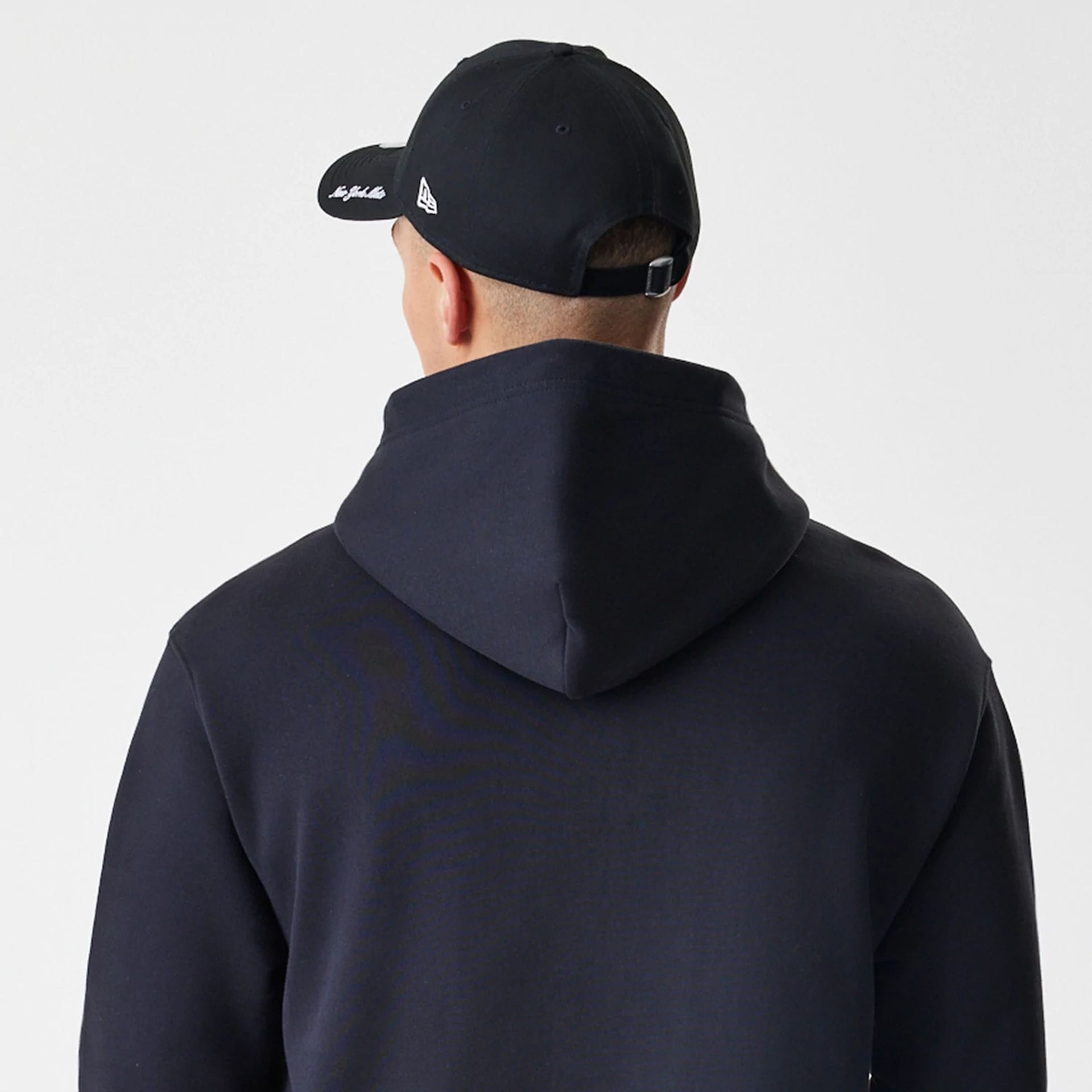 The Male model is wearing New York Mets MLB Script Black Oversized Pullover Hoodie 8
