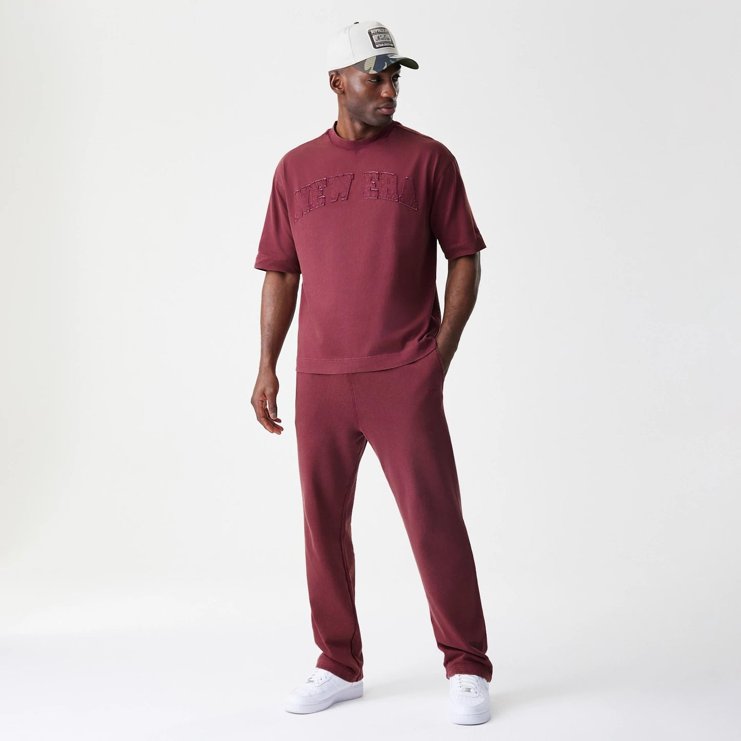 The Male model is wearing  New Era Washed Dark Red Straight Leg Joggers 8
