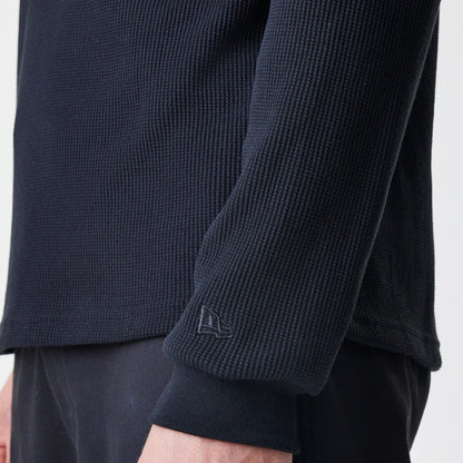 The Male model is wearing  New Era Waffle Black Long Sleeve T-Shirt 5