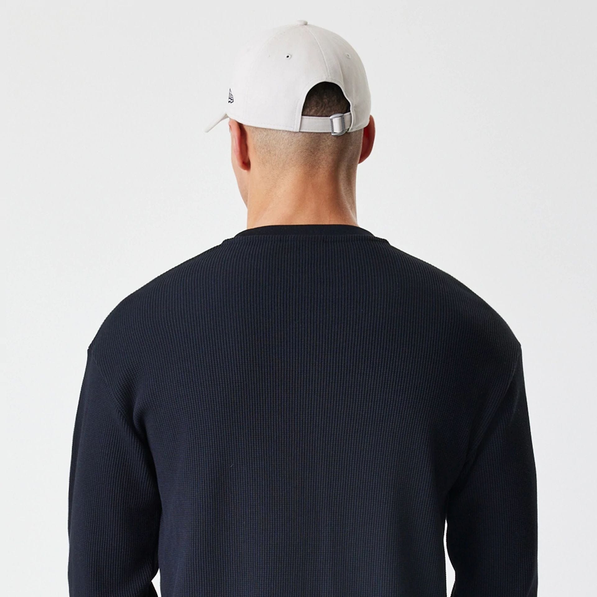 The Male model is wearing  New Era Waffle Black Long Sleeve T-Shirt  7