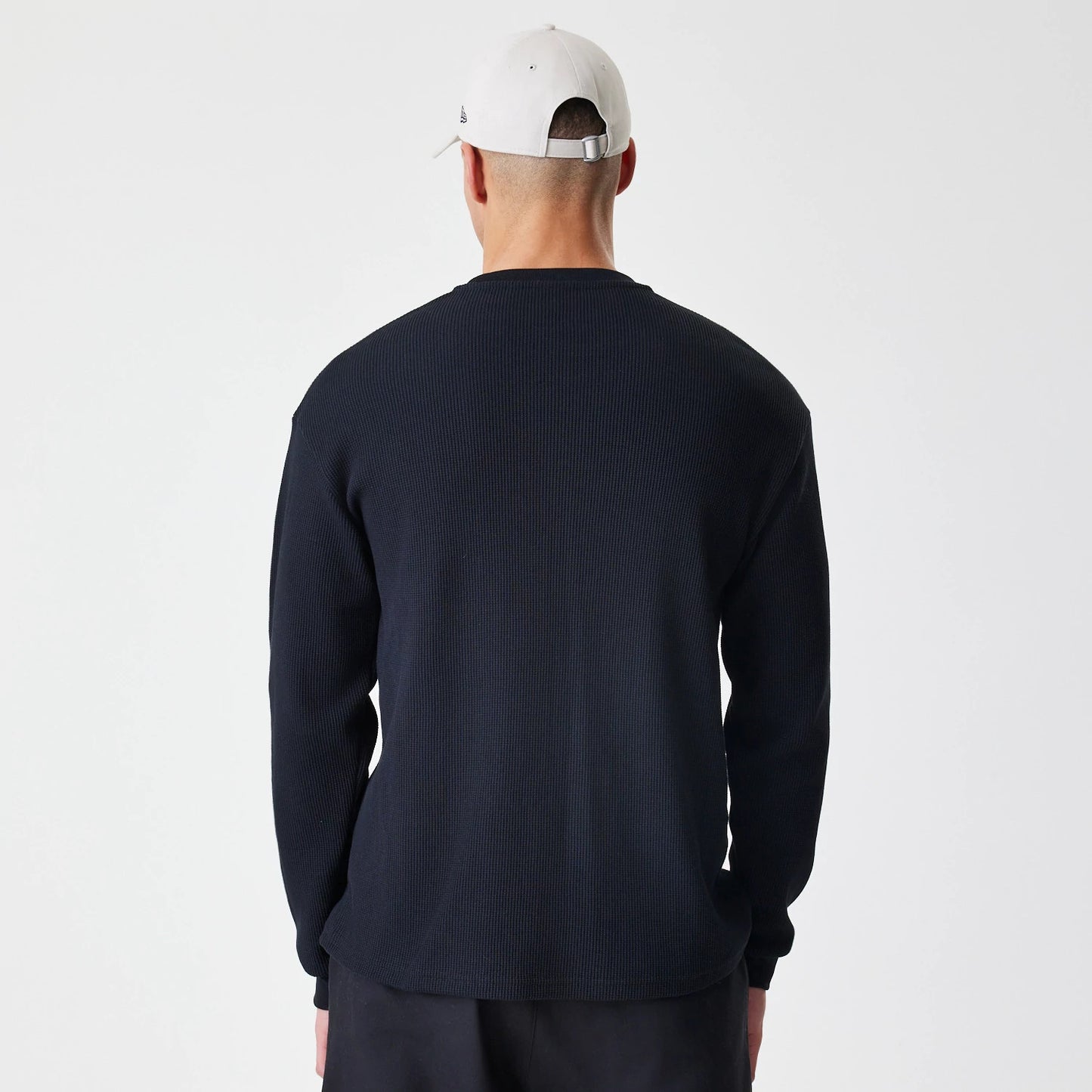 The Male model is wearing  New Era Waffle Black Long Sleeve T-Shirt 2