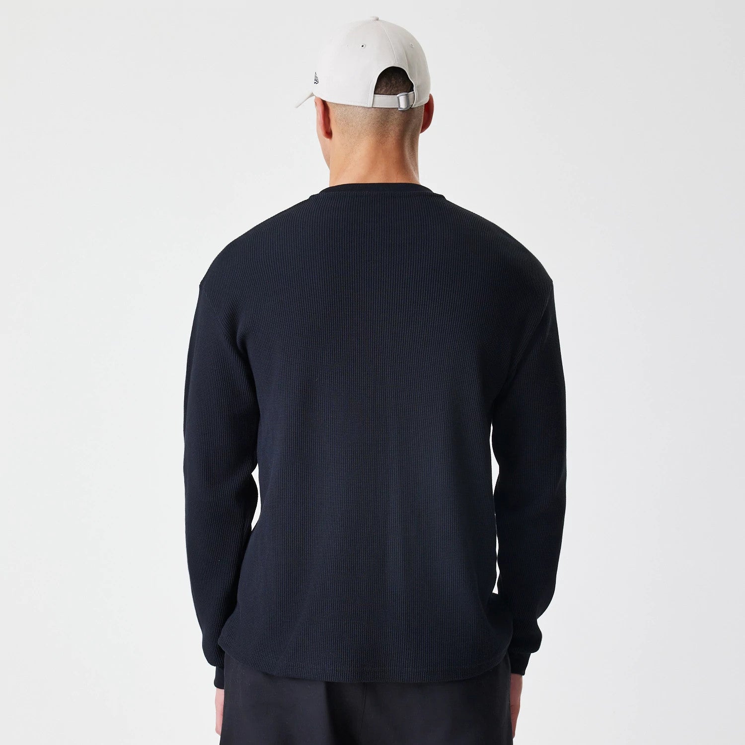 The Male model is wearing  New Era Waffle Black Long Sleeve T-Shirt 2