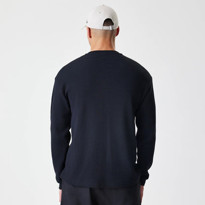The Male model is wearing  New Era Waffle Black Long Sleeve T-Shirt 2