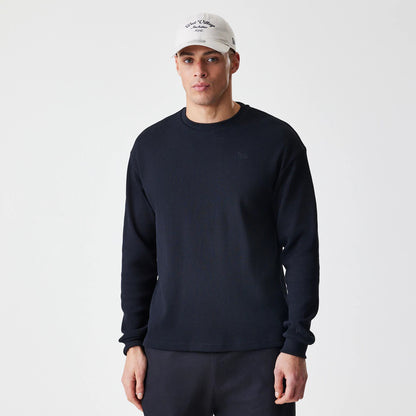 The Male model is wearing  New Era Waffle Black Long Sleeve T-Shirt 1
