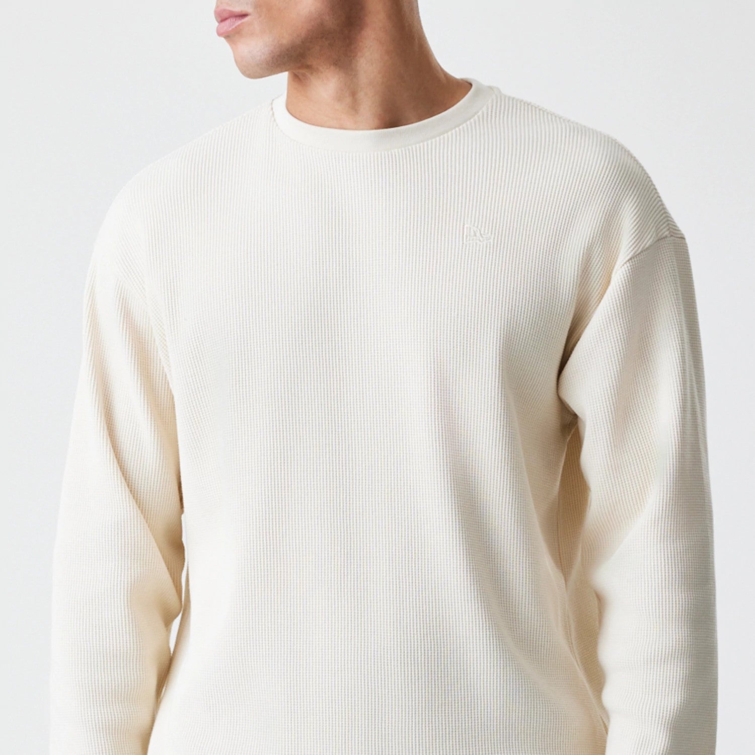 The Male model is wearing  New Era Waffle Light Beige Long Sleeve T-Shirt 3