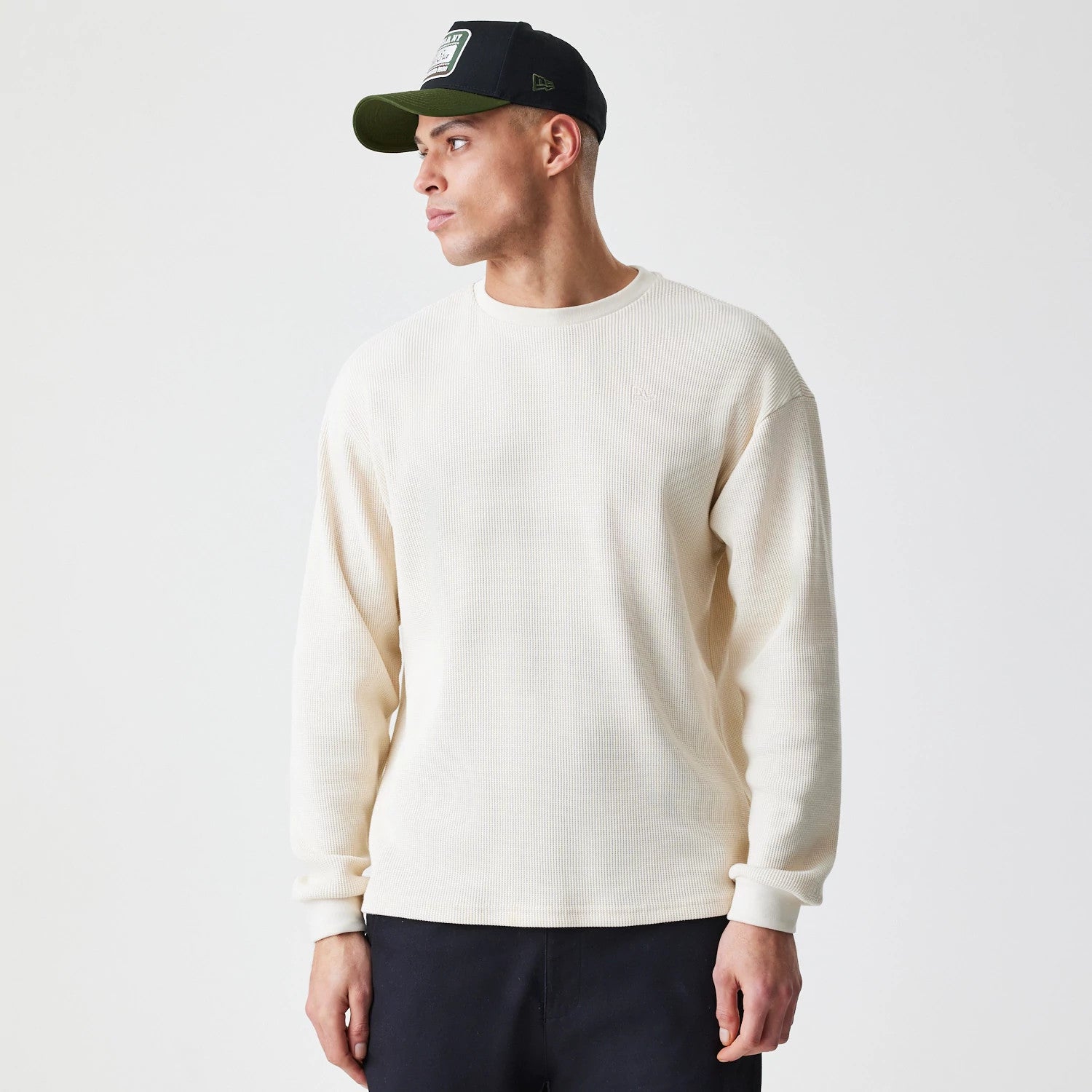 The Male model is wearing  New Era Waffle Light Beige Long Sleeve T-Shirt 1