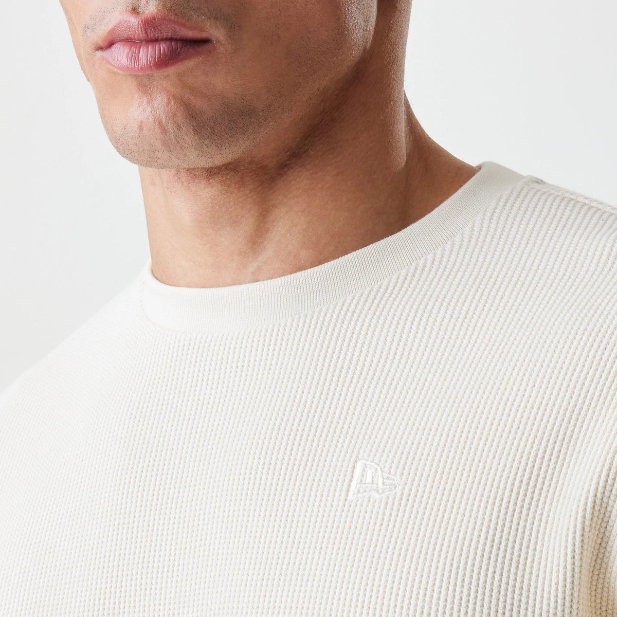 The Male model is wearing  New Era Waffle Light Beige Long Sleeve T-Shirt 6