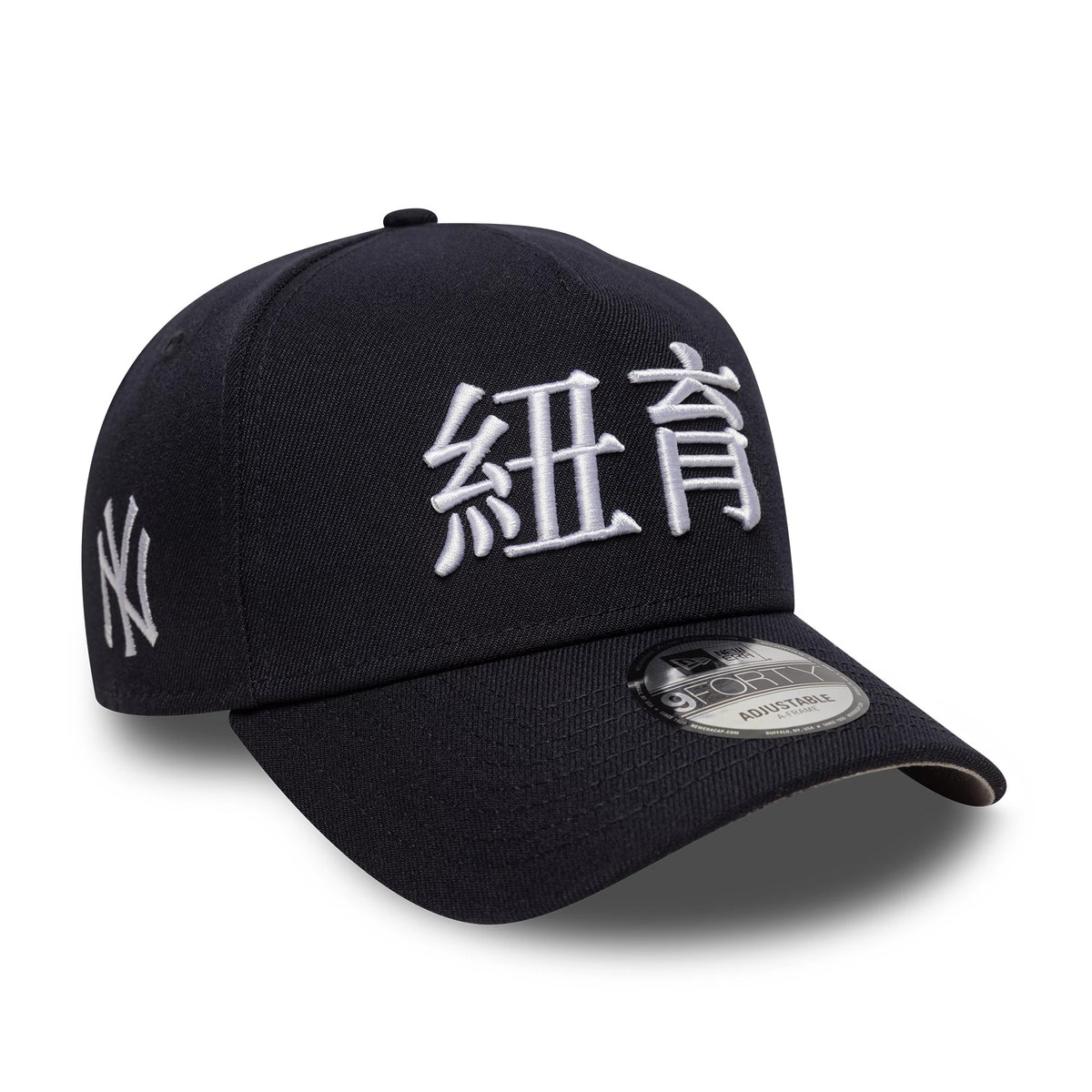 New York Yankees MLB Poly Kanji Navy New Era 9FORTY A-Frame Adjustable Cap, three-quarter view showing white kanji embroidery on the front panel, grey undervisor, and an NY logo on the left side, with a 9FORTY size sticker on the curved visor.