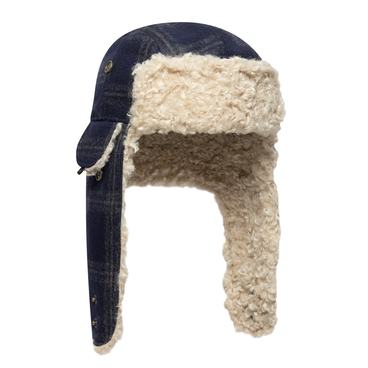 New Era Loden Navy Trapper Hat, side view showing navy flaps with button closures and a cream sherpa lining that extends to cover the ears and neck, offering a snug fit and warm appearance.