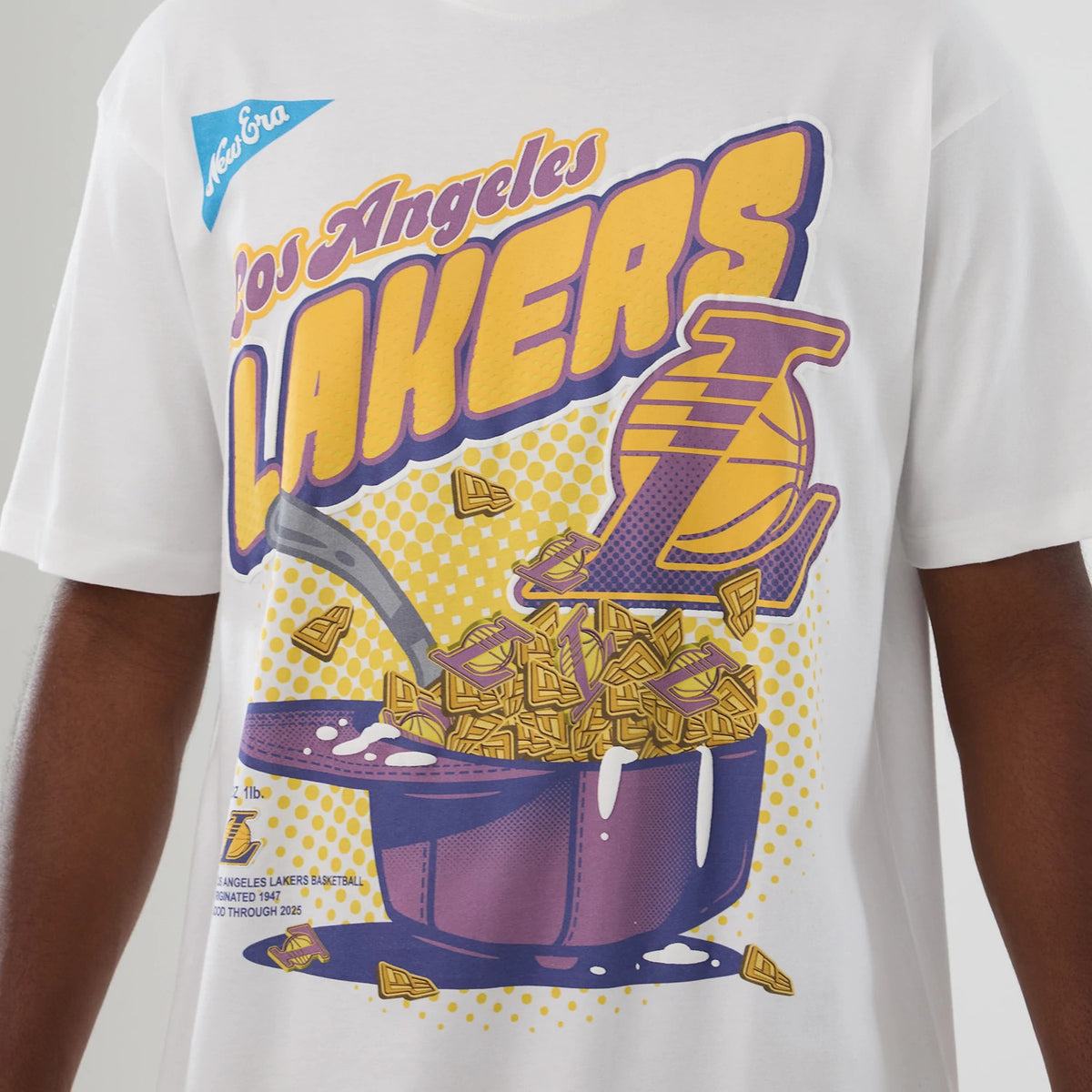 New Era LA Lakers NBA Lifestyle Graphic White T-Shirt, front view displaying a colourful graphic design with large purple and yellow Lakers lettering, a basketball-themed image, and an embroidered New Era logo on the upper chest.