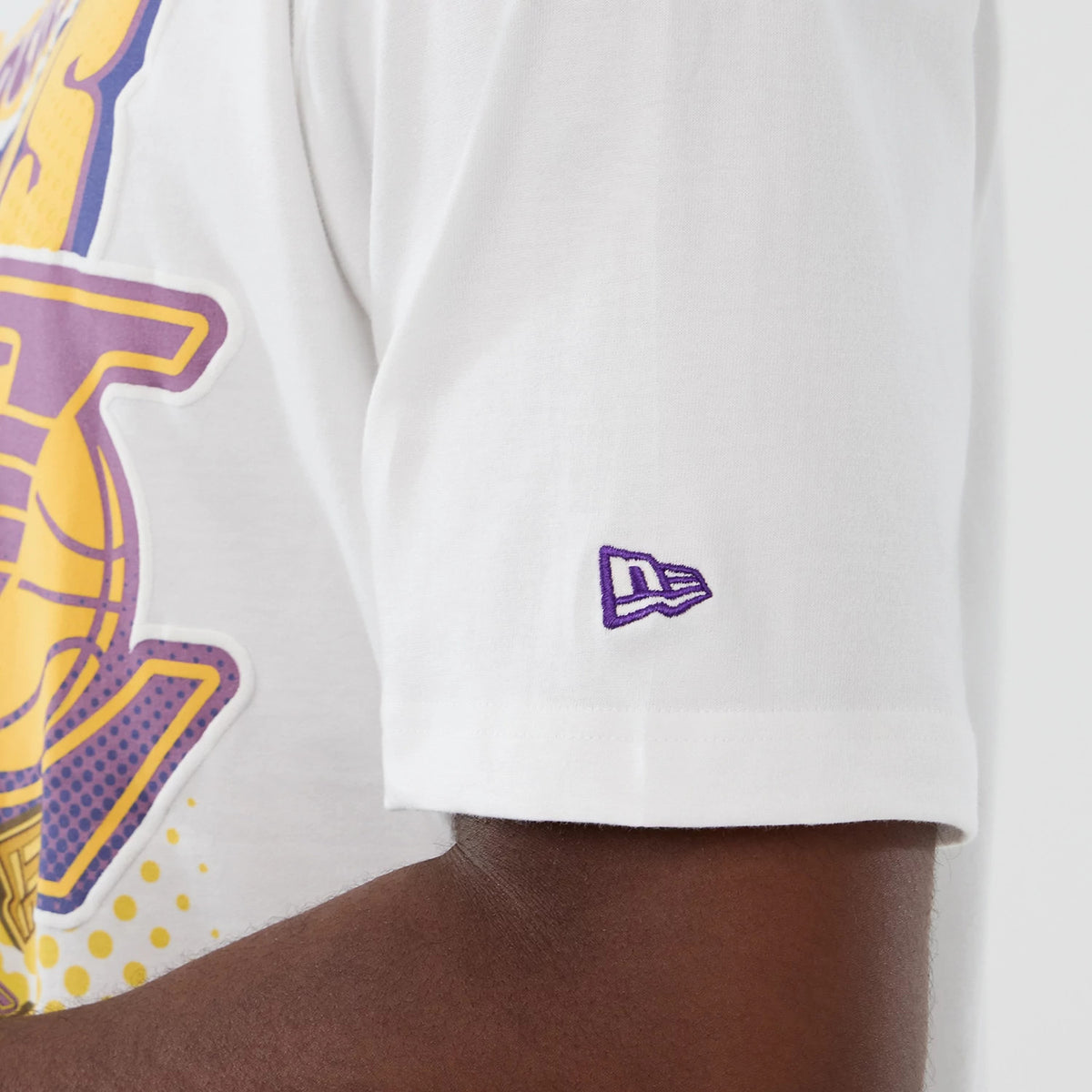 New Era LA Lakers NBA Lifestyle Graphic White T-Shirt, side view showing the large purple and yellow Lakers graphic across the chest and an embroidered purple New Era logo on the sleeve.