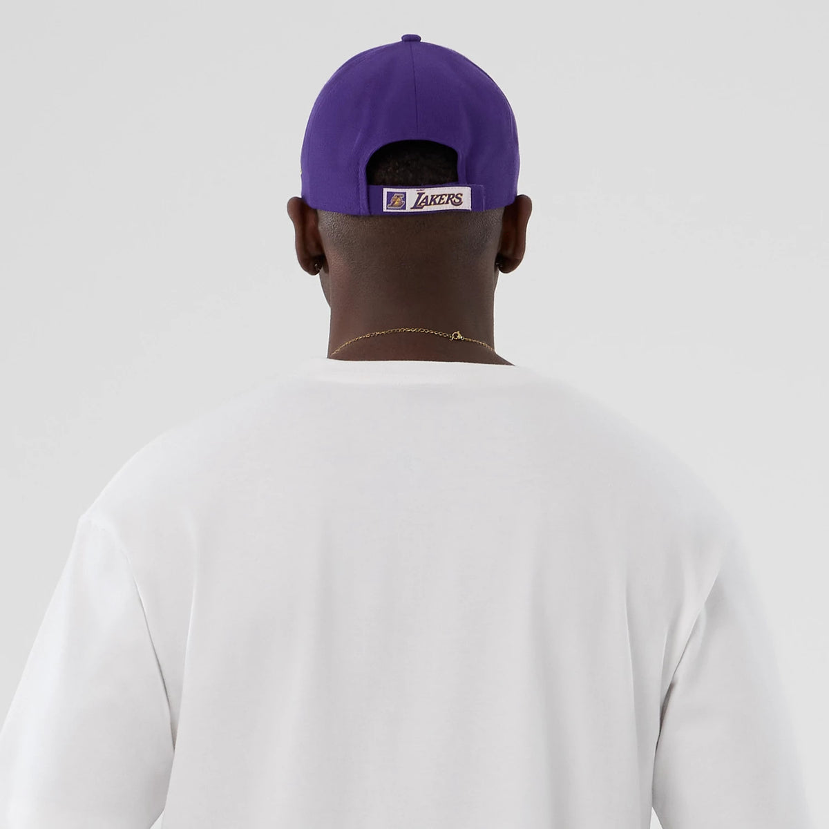 The Male model is wearing LA Lakers NBA Lifestyle Graphic White T-Shirt 6