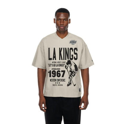 The Male model is wearing LA Kings NHL Throwback Prep Light Beige T-Shirt 1