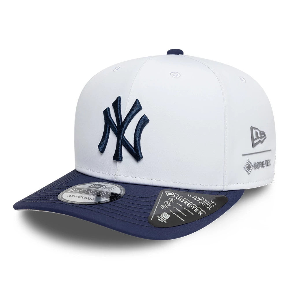 New York Yankees MLB Gore-Tex White New Era 9SEVENTY Stretch Snap Adjustable Cap, three-quarter view showing a raised navy team logo on the front panel, with the Gore-Tex logo on the white crown and a navy visor with a 9SEVENTY size sticker.