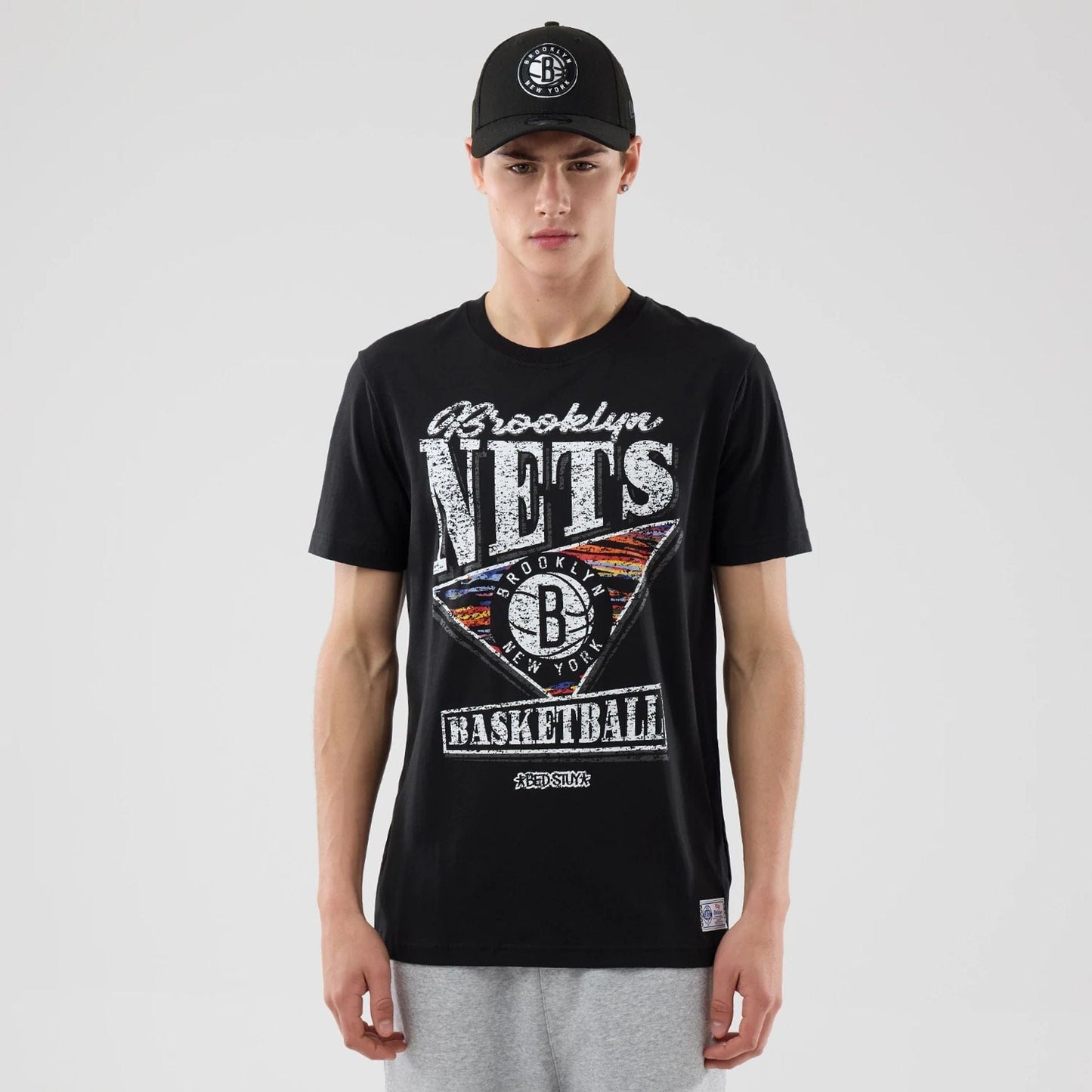 The Male model is wearing Brooklyn Nets NBA City Edition Black T-Shirt  1