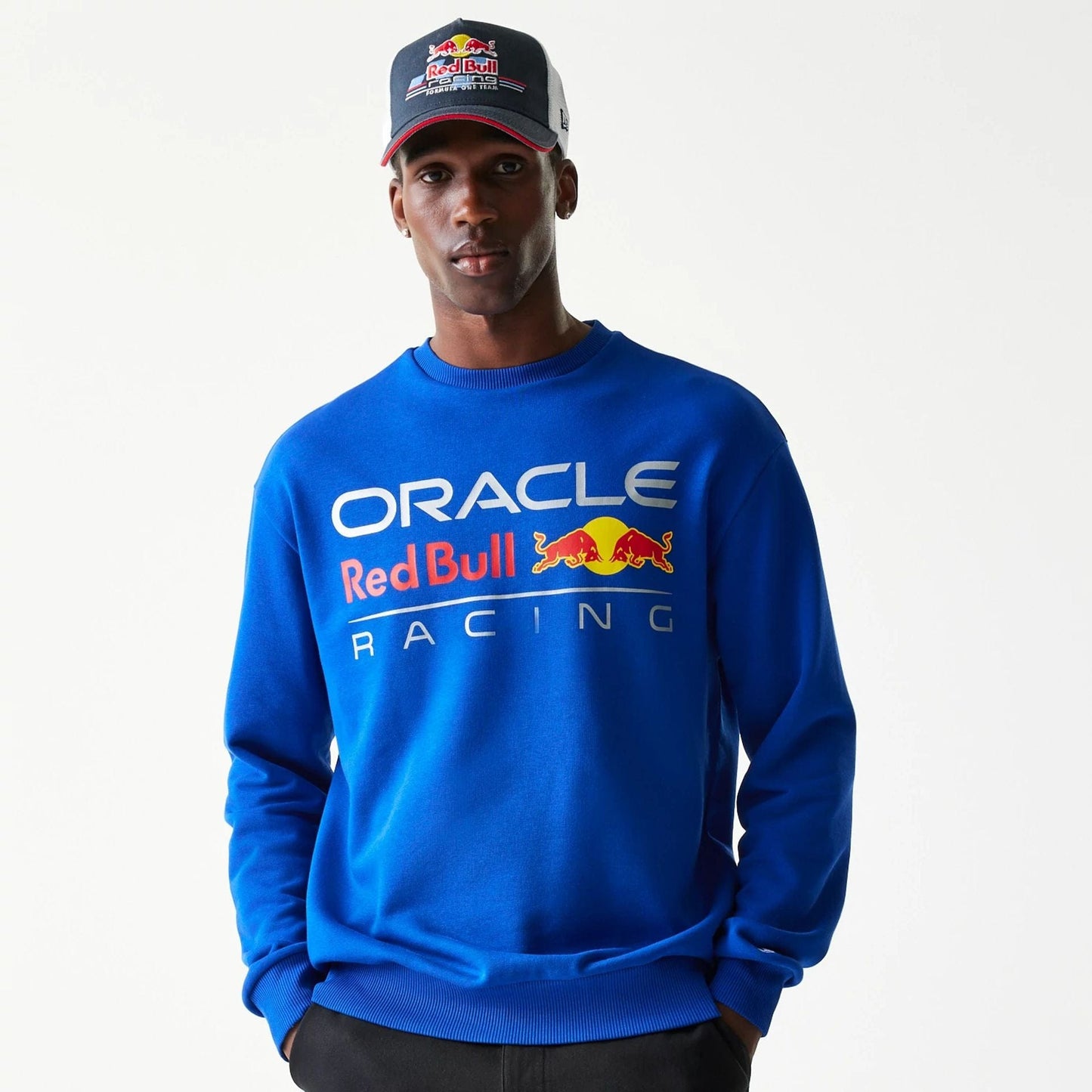 The Male model is wearing Red Bull Racing Blue Oversized Crew Neck Sweater 1