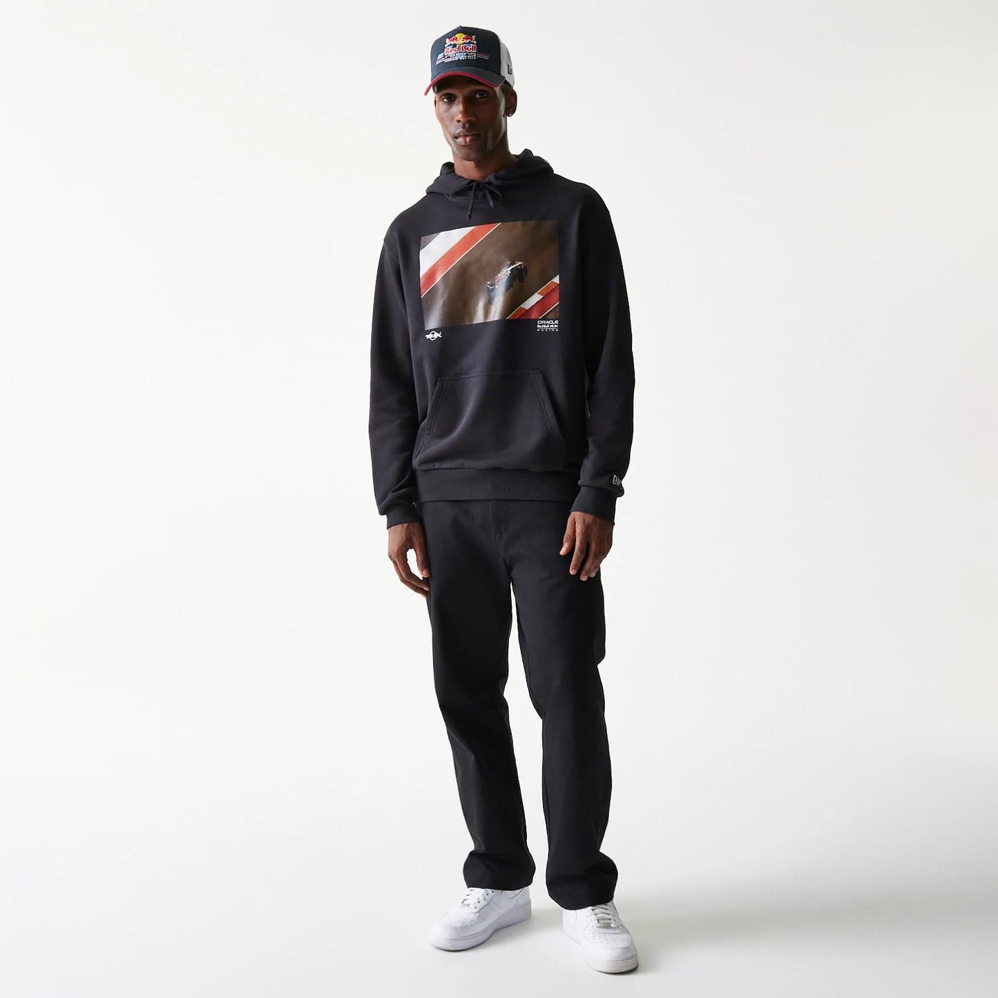 The Male model is wearing Red Bull Racing Black Oversized Pullover Hoodie 7