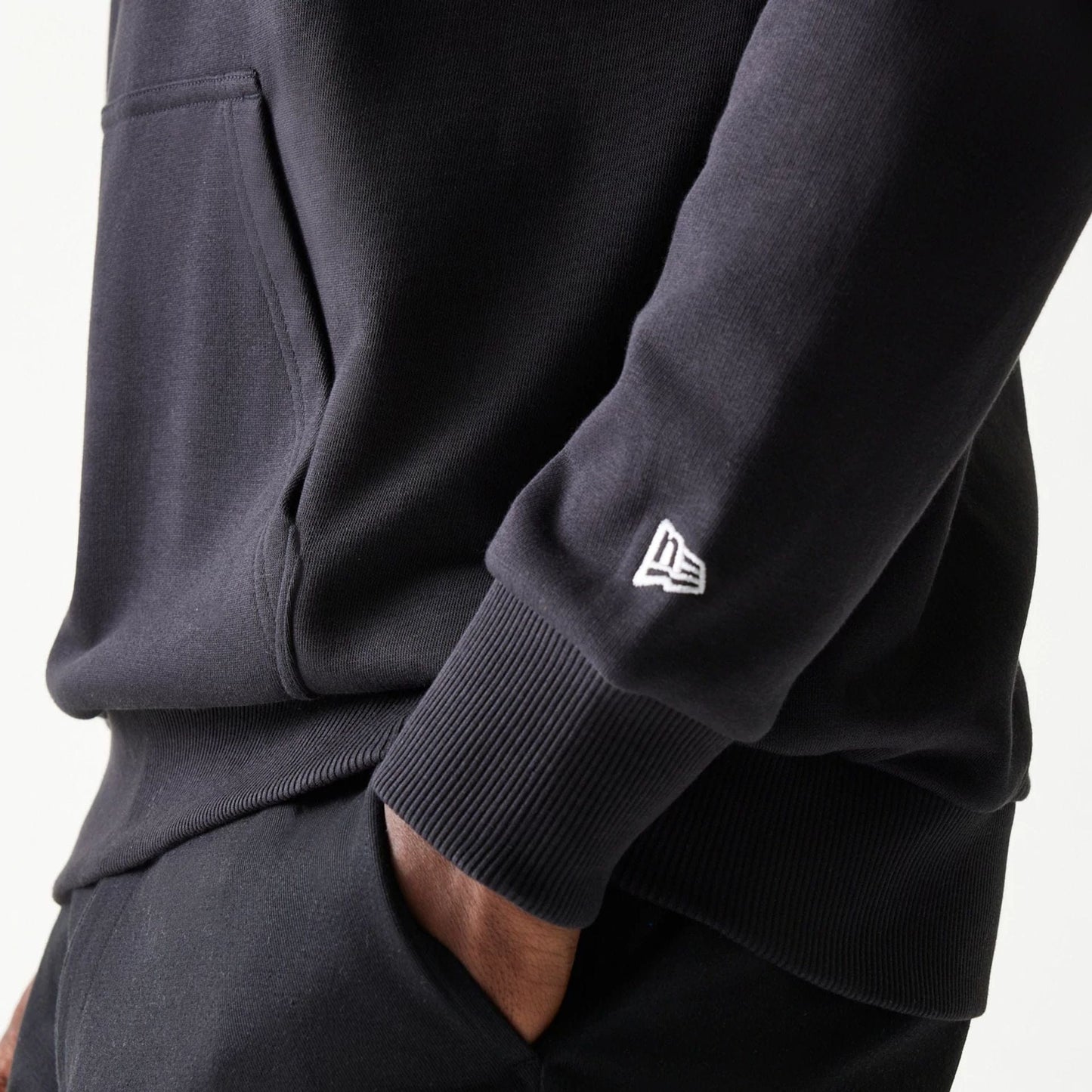 The Male model is wearing Red Bull Racing Black Oversized Pullover Hoodie 4