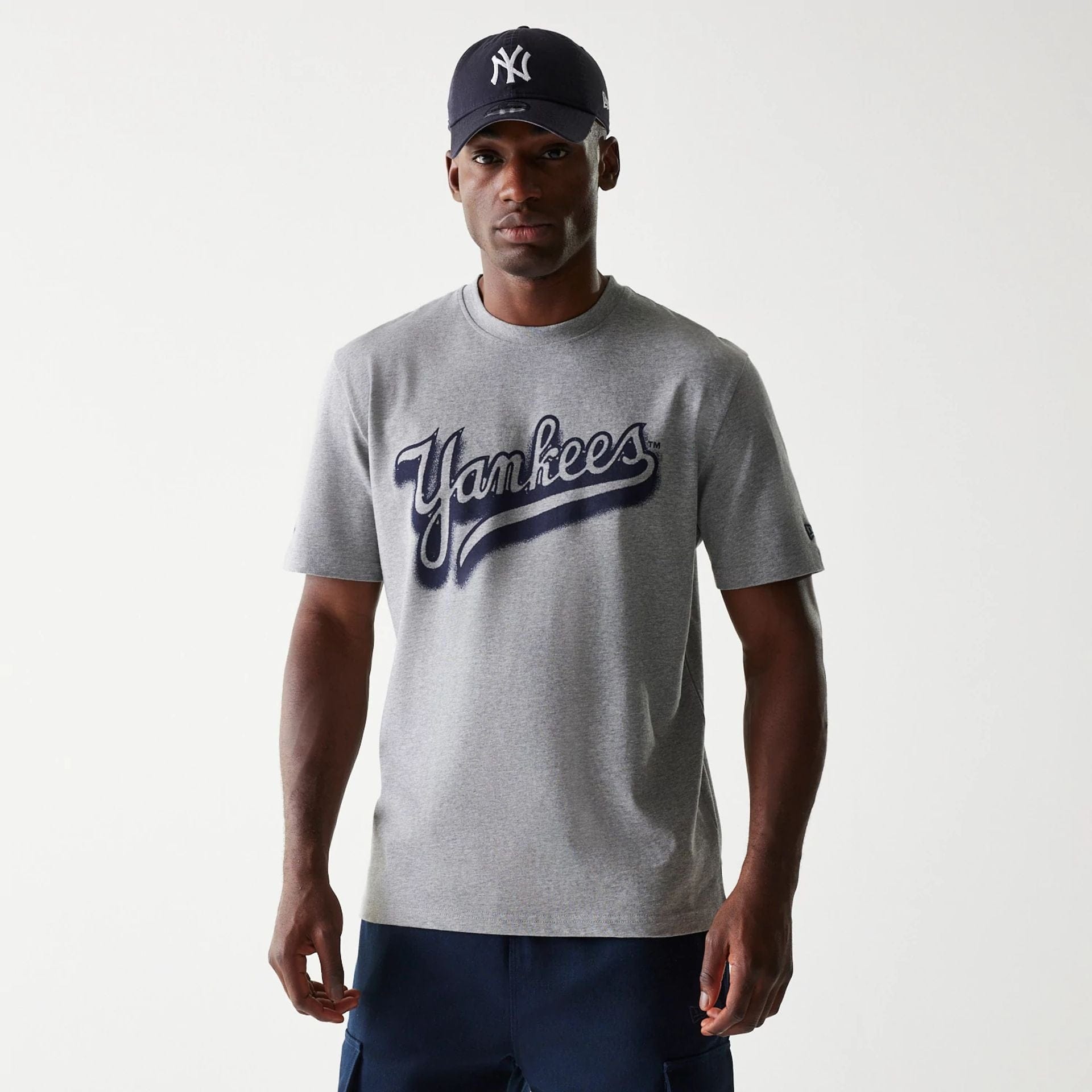 The Male model is wearing New York Yankees OVO x MLB Grey T-Shirt 1