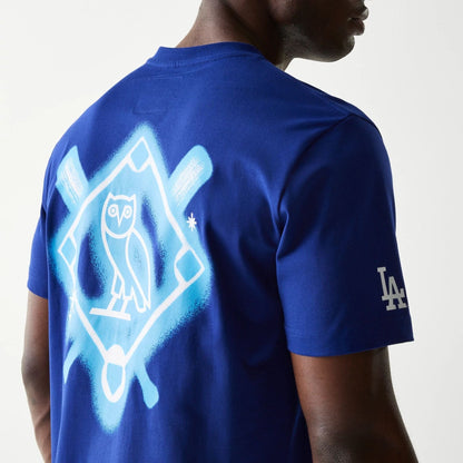 The Male model is wearing LA Dodgers OVO x MLB Dark Blue T-Shirt 7