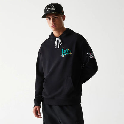The Male model is wearing Netflix Squid Game Black Oversized Pullover Hoodie 1