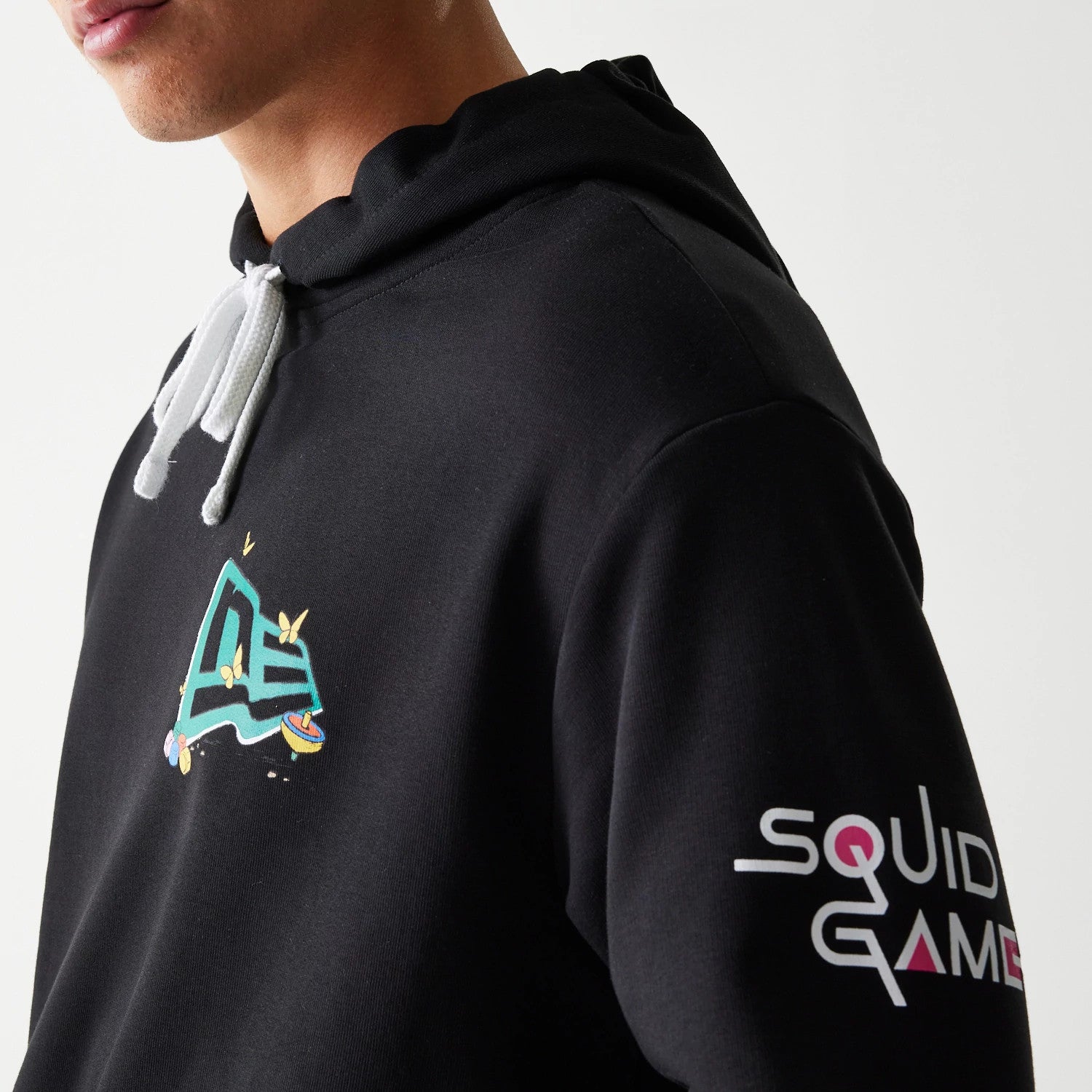 The Male model is wearing Netflix Squid Game Black Oversized Pullover Hoodie 6