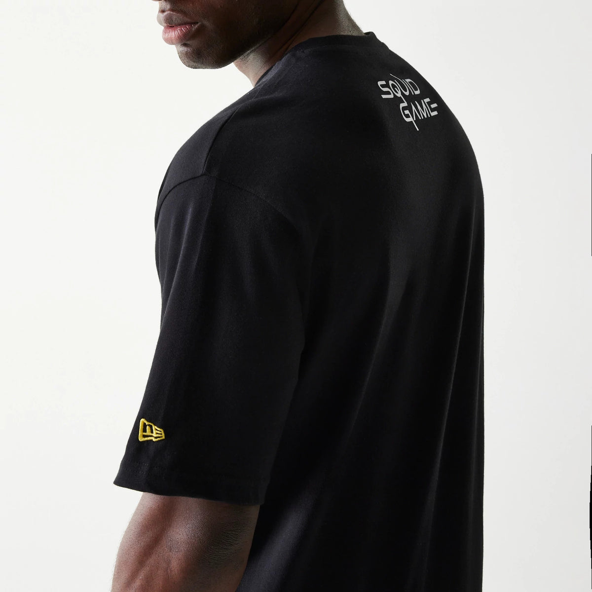 The Male model is wearing Netflix Squid Game Black Oversized T-Shirt 6