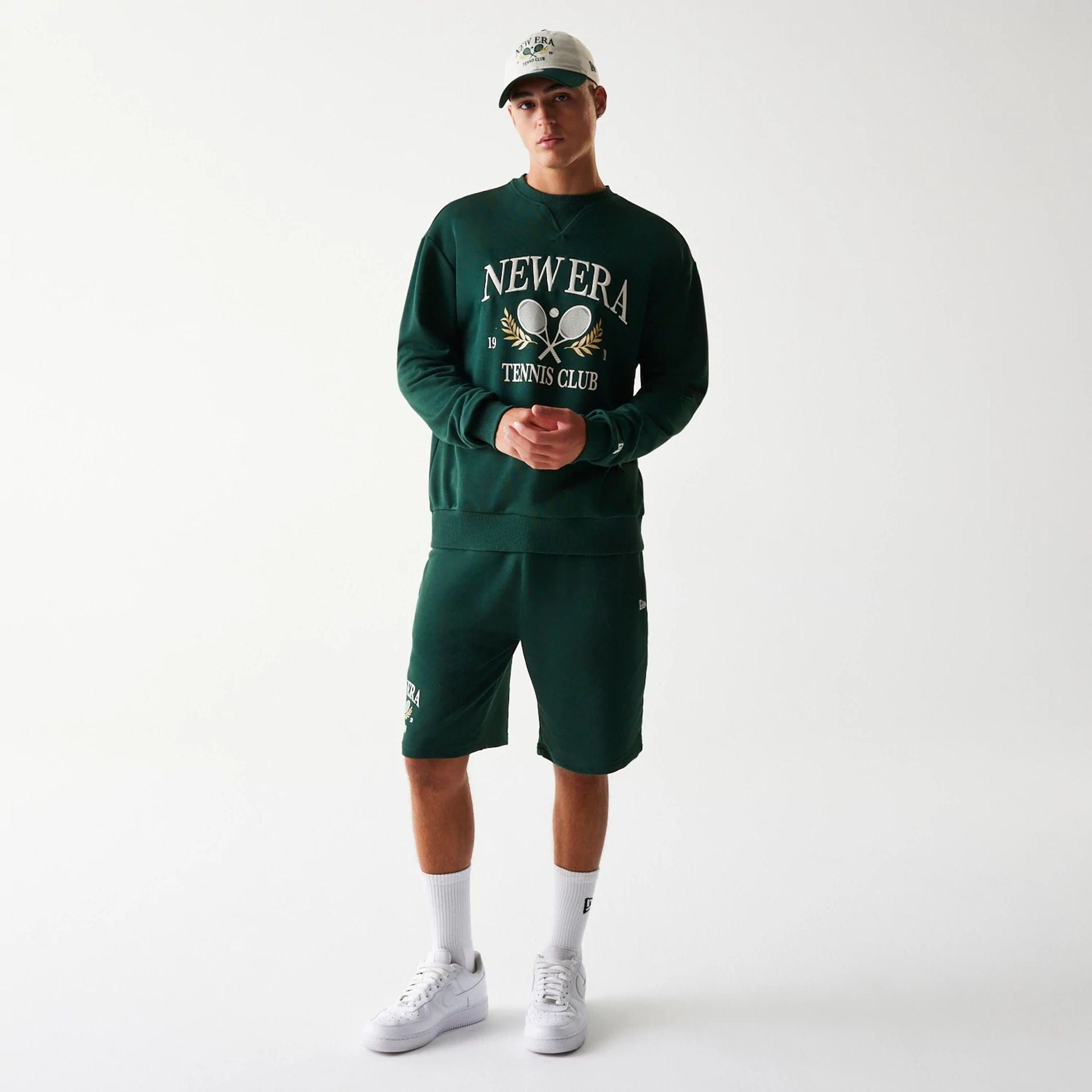 The Male model is wearing New Era Dark Green Oversized Crew Neck Sweater 8