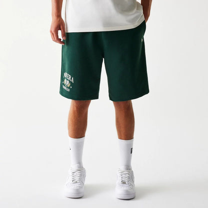 The Male model is wearing New Era Front Logo Dark Green Shorts 1